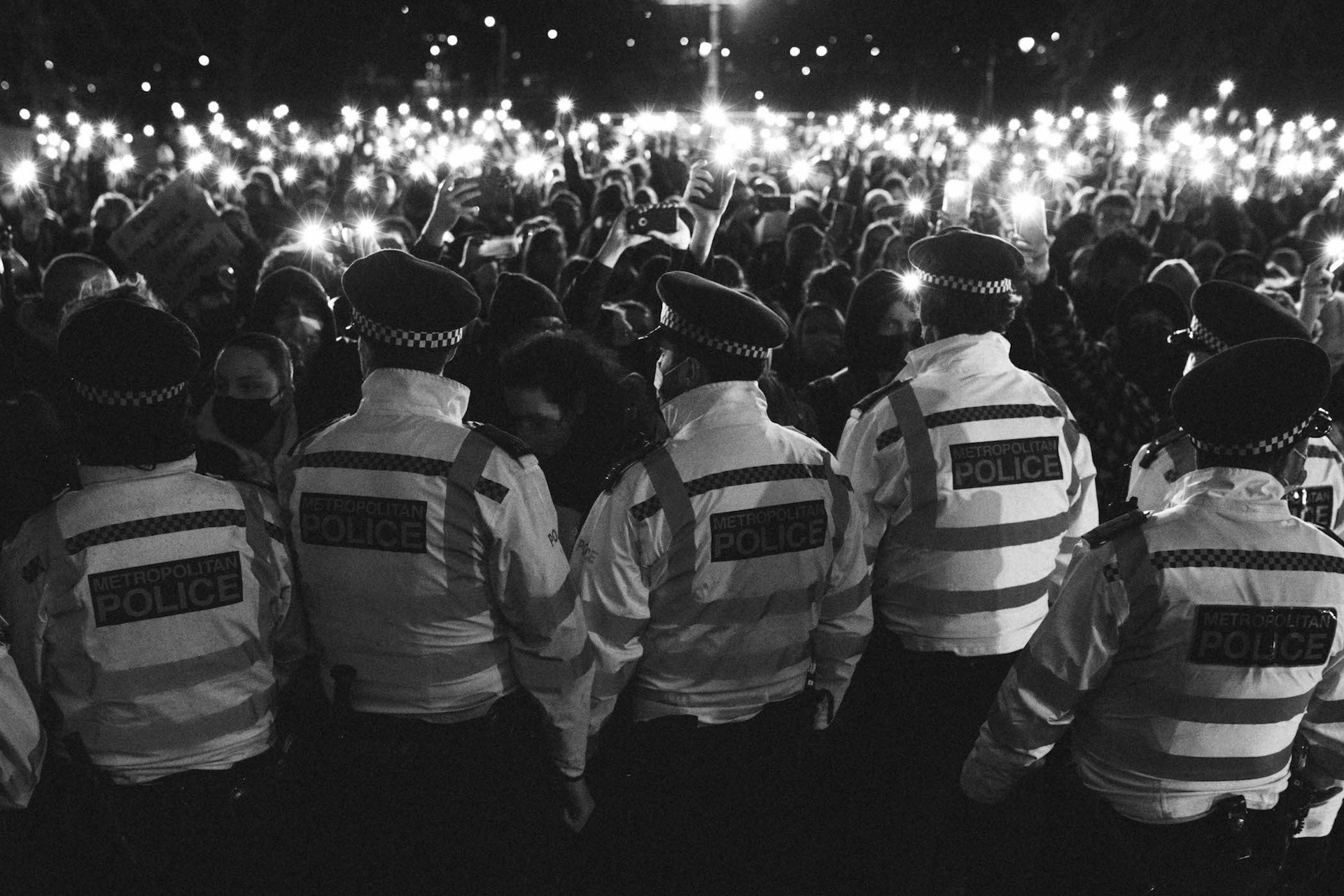 Police storming the vigil for Sarah Everard, in photos