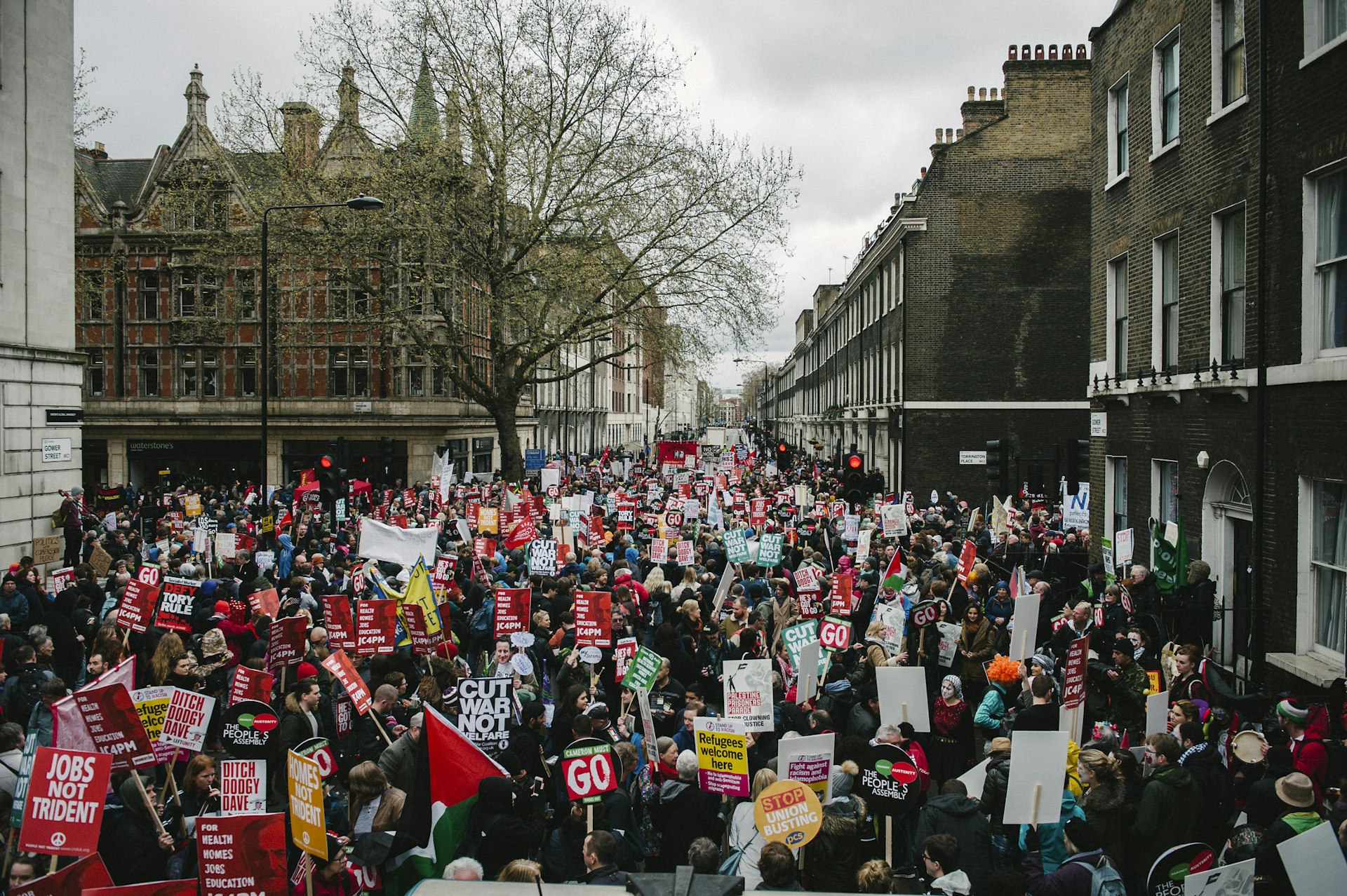 Tens of thousands march through London to demand an end to austerity