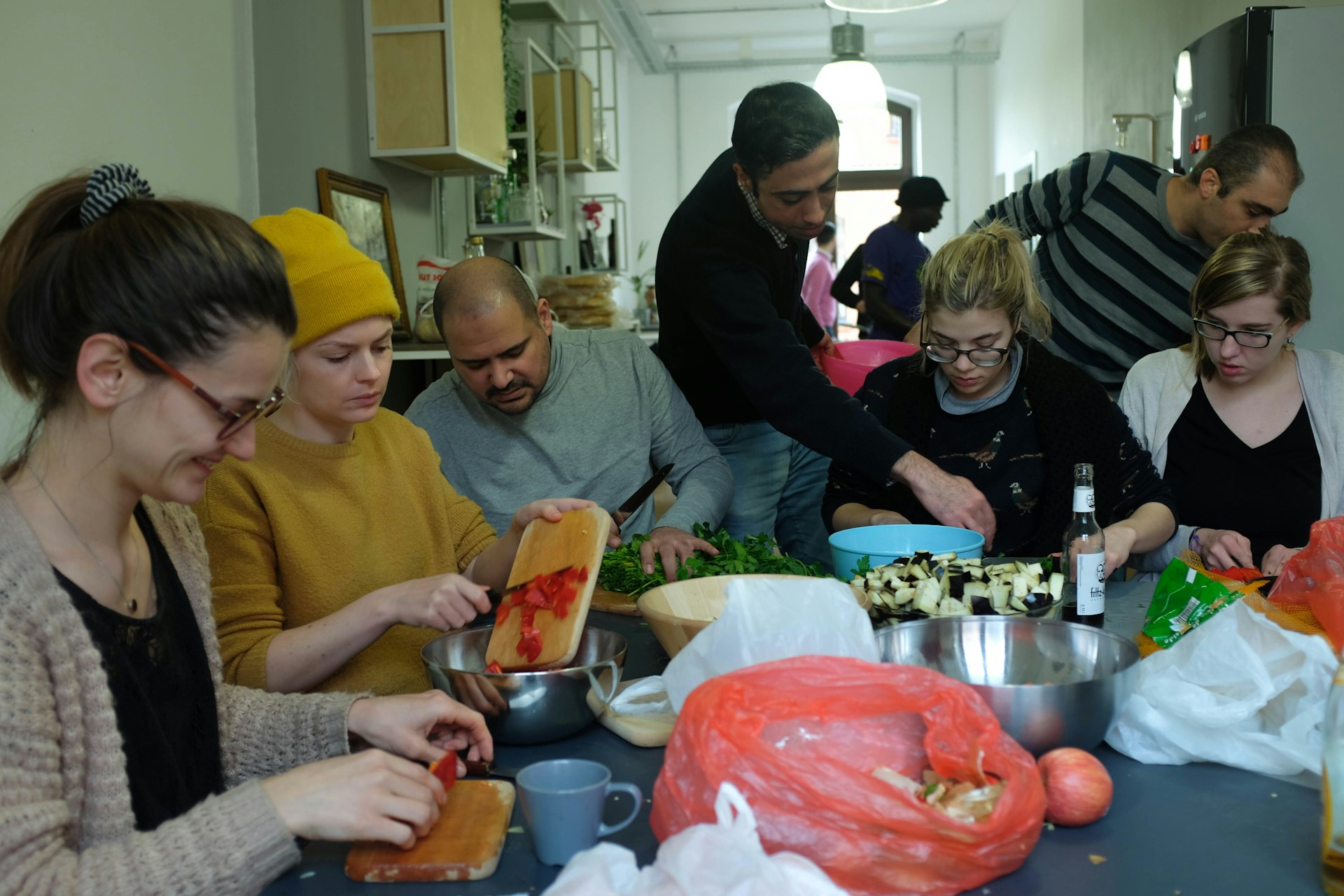 Refugees and young Berliners are finding community through food