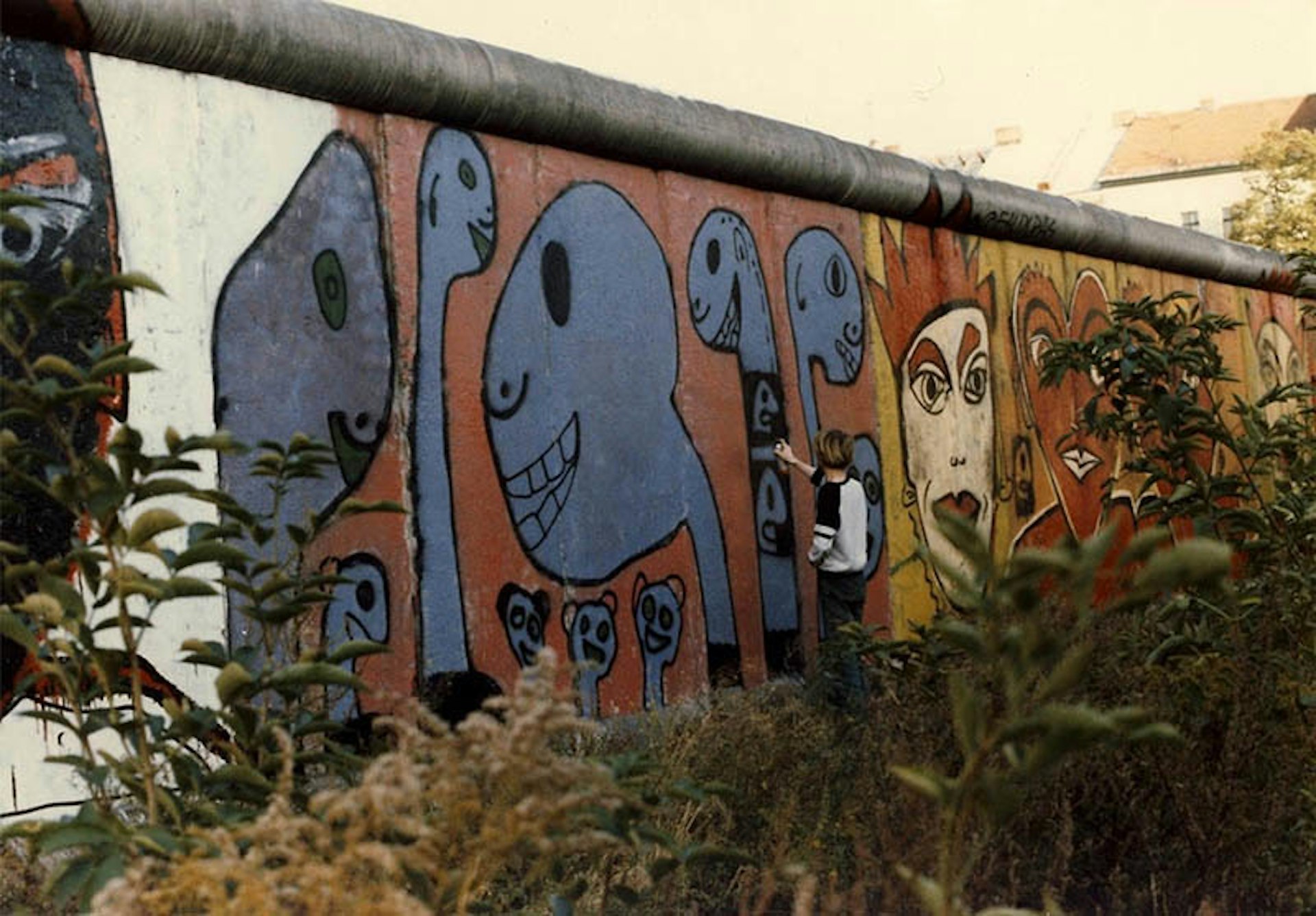 First artist to paint the Berlin Wall describes the city today