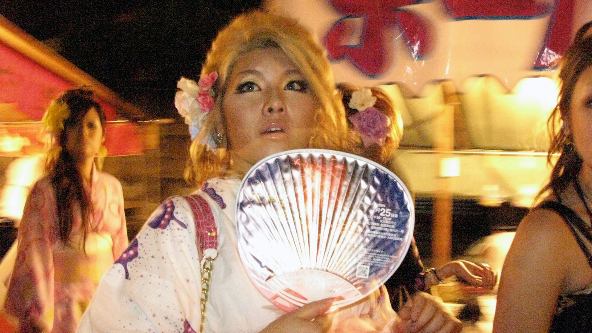 Tenjin Matsuri in Osaka, a summertime Carnival of sorts replete with kimonos, portable shrines, fireworks, and fan-waving nubiles with $1,500 handbags.
