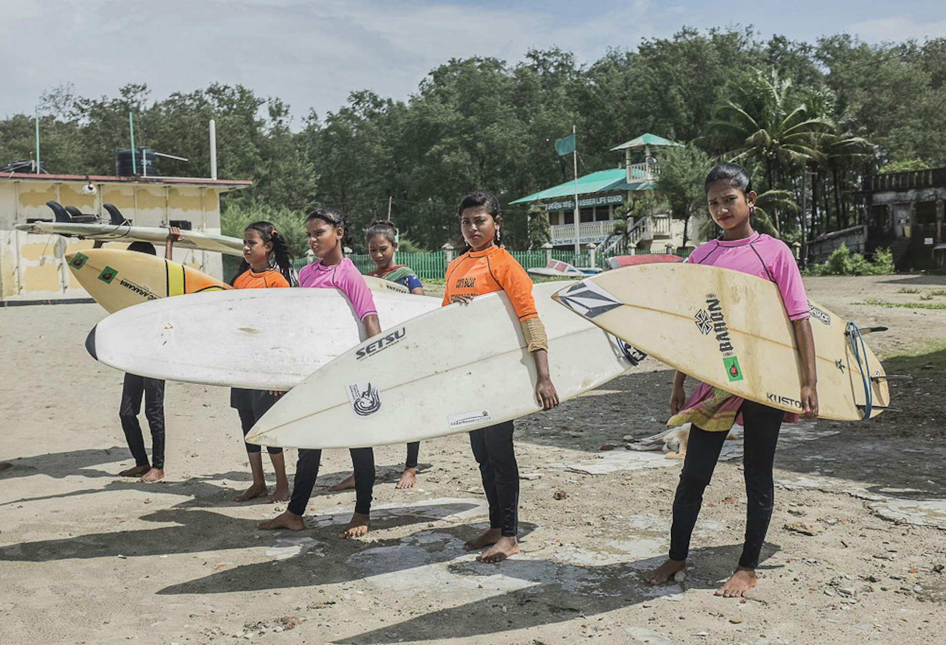 The girls are getting ready for surfing at Cox's Bazar's beach, Bangladesh