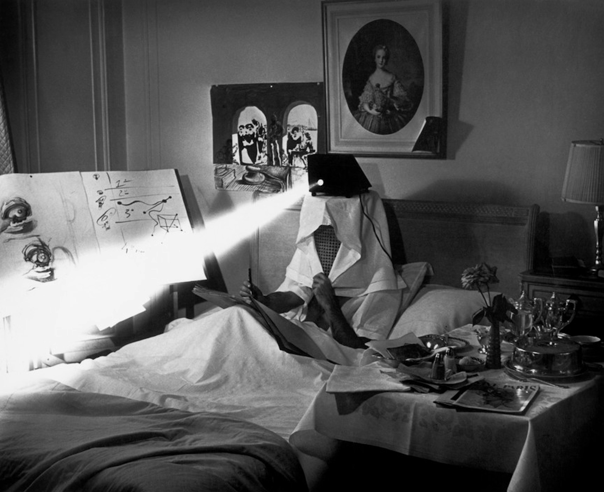 DALI in bed, projecting pieces of dirty paper "to stimulate his inspiration".