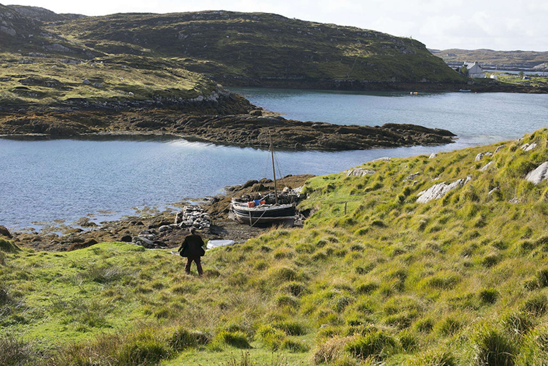 Gavin heading for his boat, 2015 . Scotland. Isle of Harris, Outer Hebrides © Olivia Arthur/Magnum Photos and Philipp Ebeling