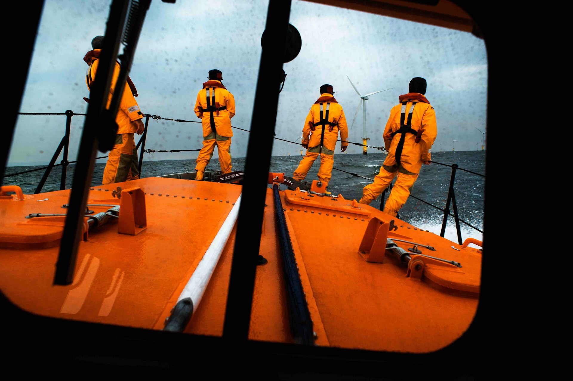 The view from the wheelhouse of the Hoylake Mersey class lifeboat Lady of Hilbre 12-005, as the crew search for a casualty in the water near the North Hoyle wind farm. Taken from The Lifeboat: Courage on our Coasts. Page 36.