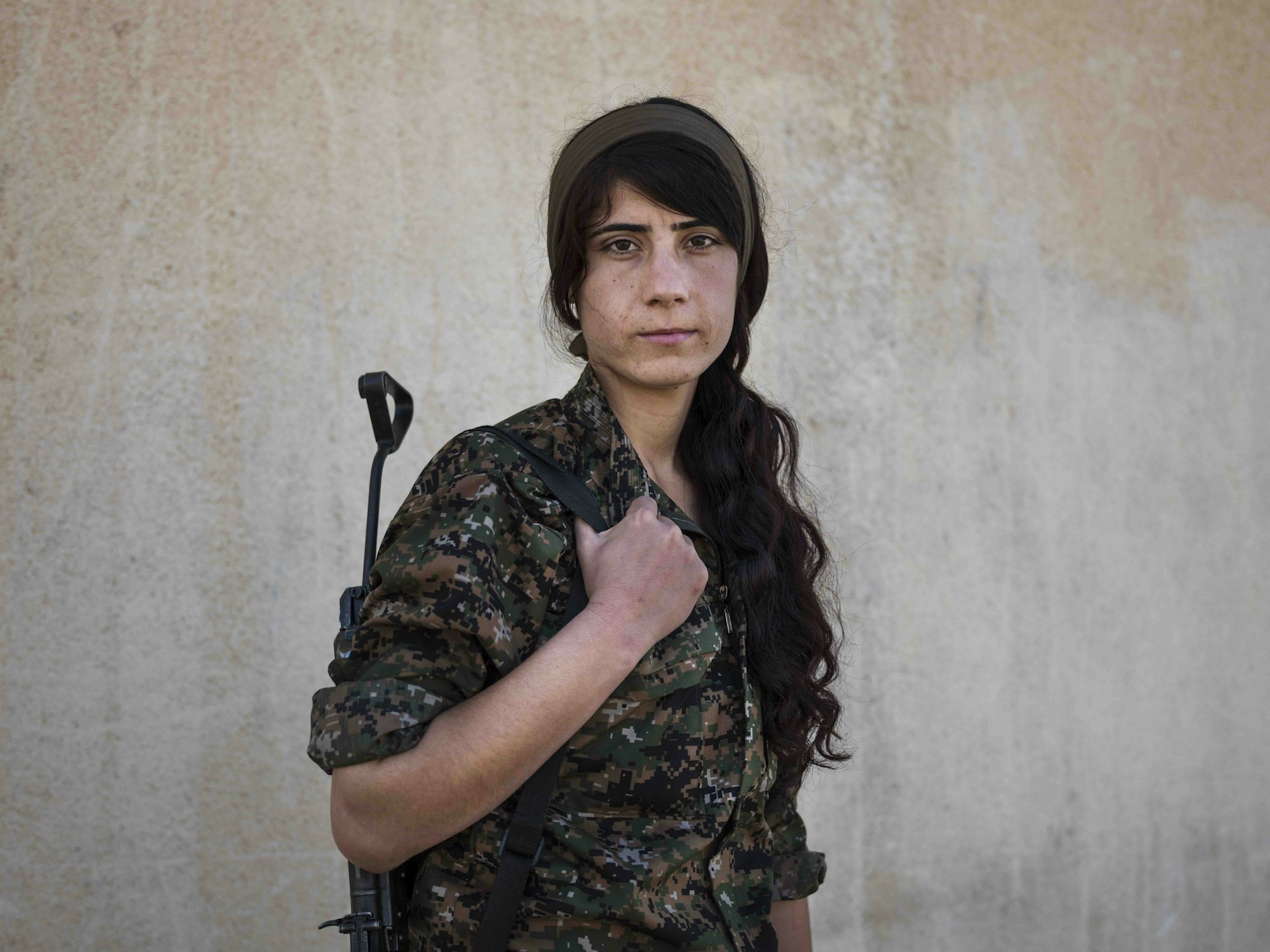 Rojava Suzdar, 21, photographed in Serikani, Syria by Newsha Tavakolian