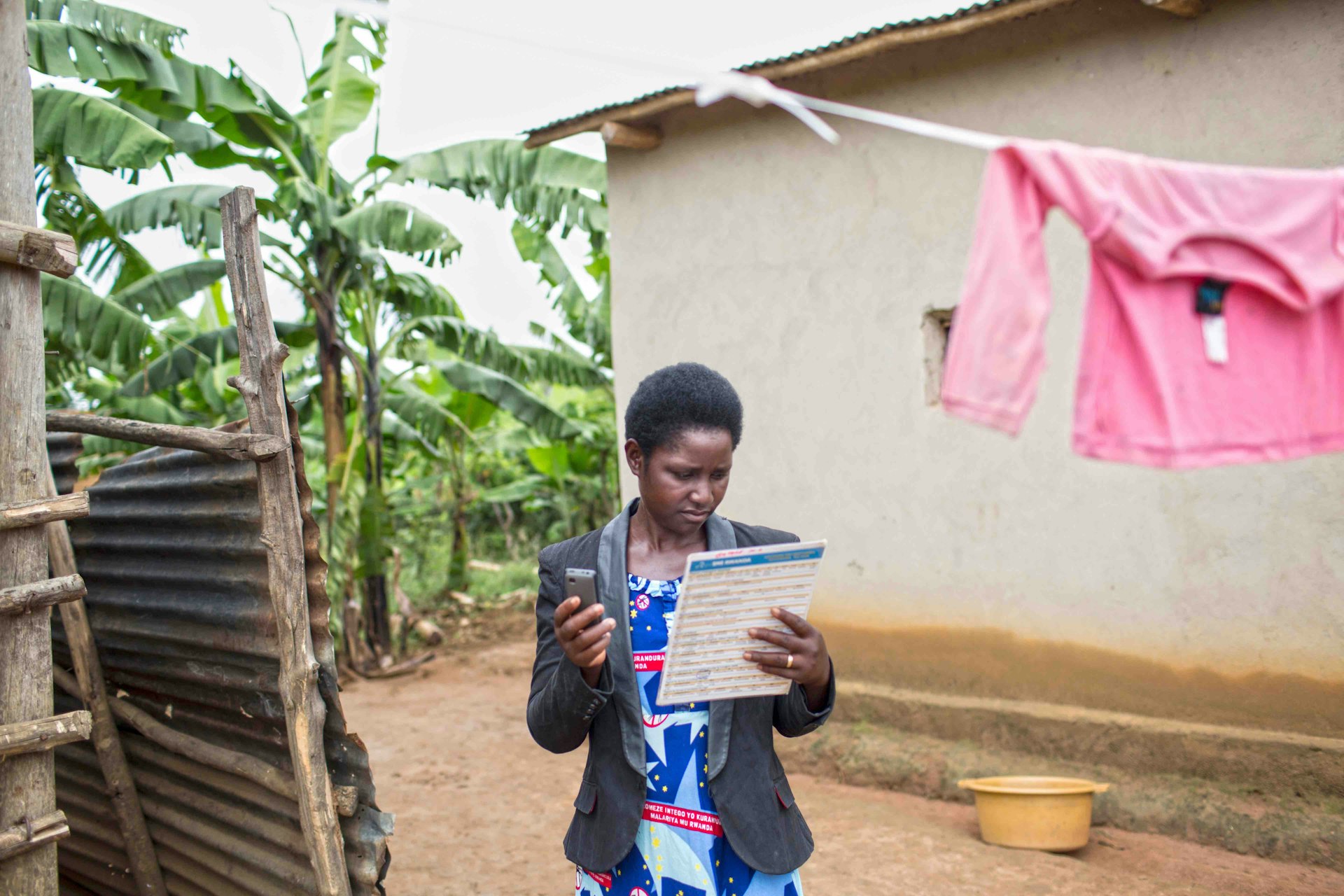 Community Health Worker Liberata Musayabiyamana uses the Rapid SMS system