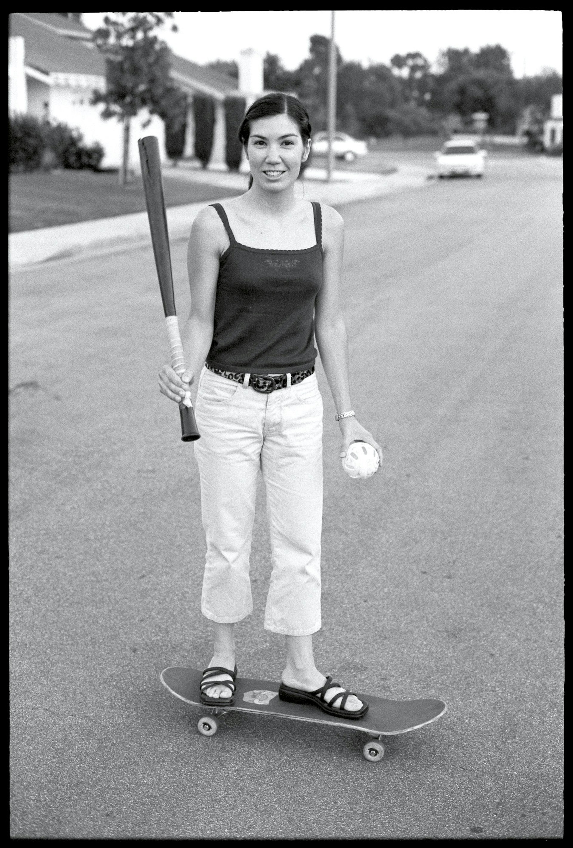 Deanna-on-skateboard-w-batEd_cmyk