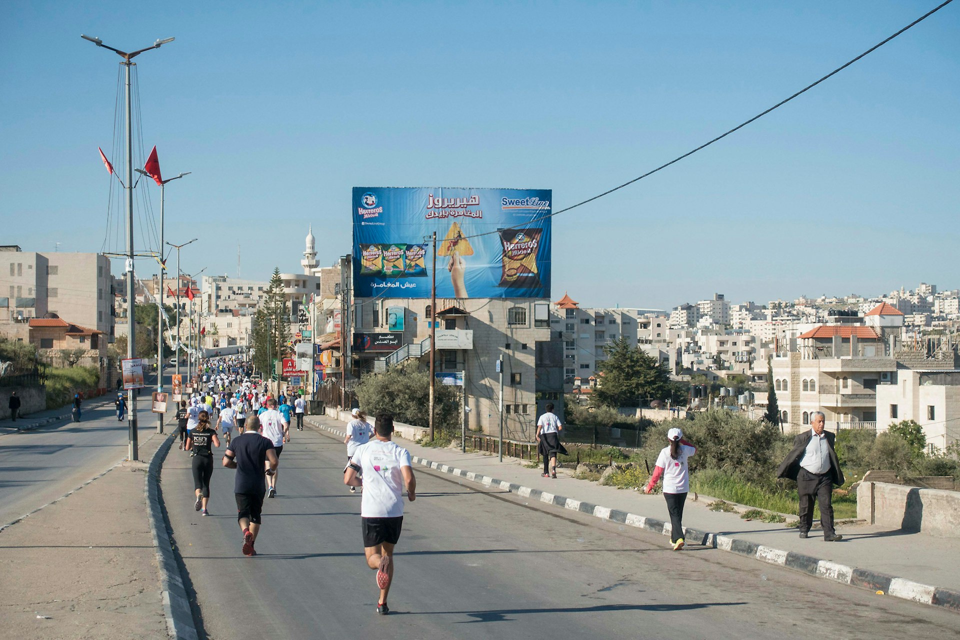 Running through along Hebron Road during the 2016 Palestine Marathon