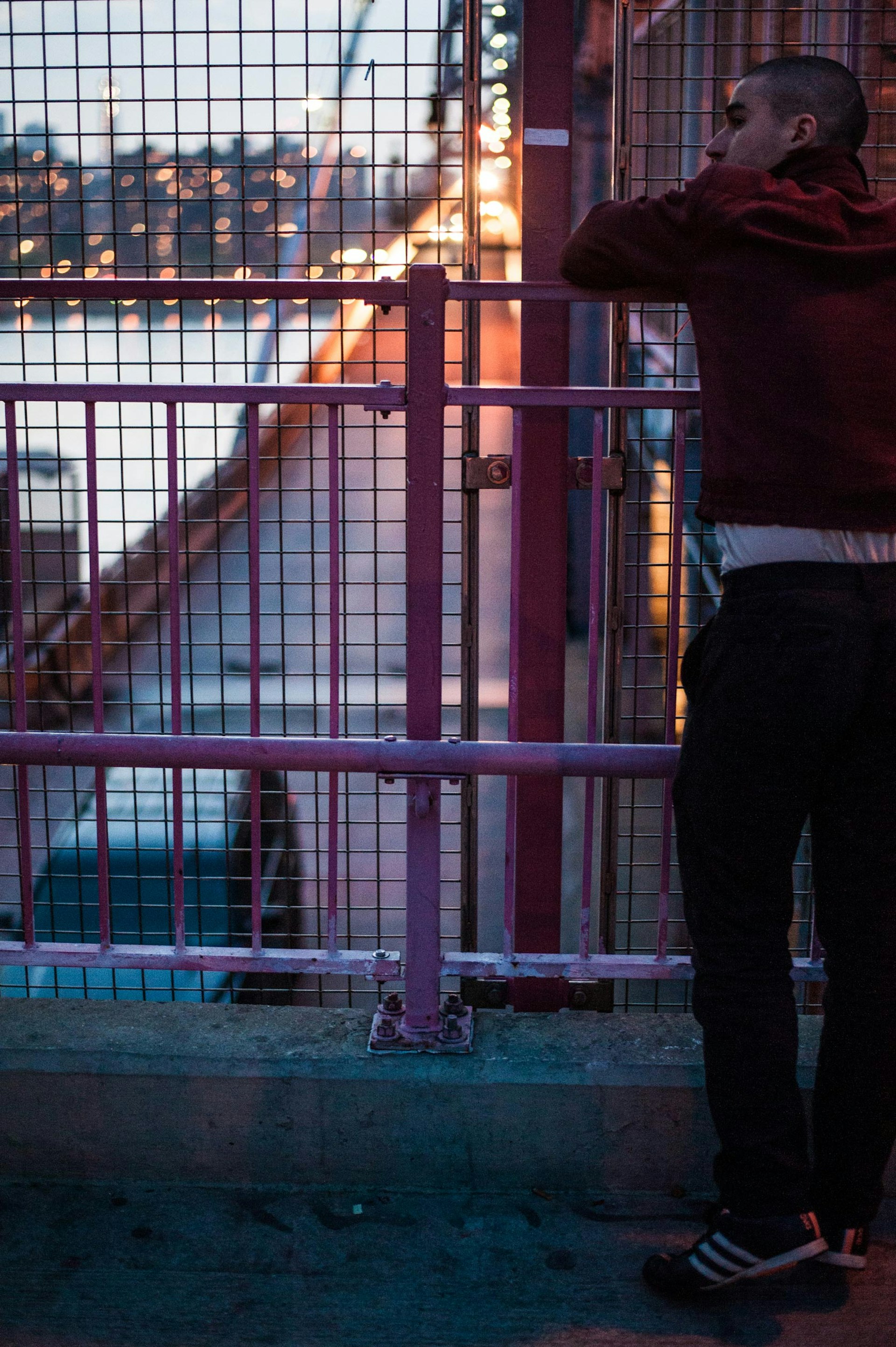 Nathan leans against the Williamsburg Bridge during an interview with Rolling Stone.