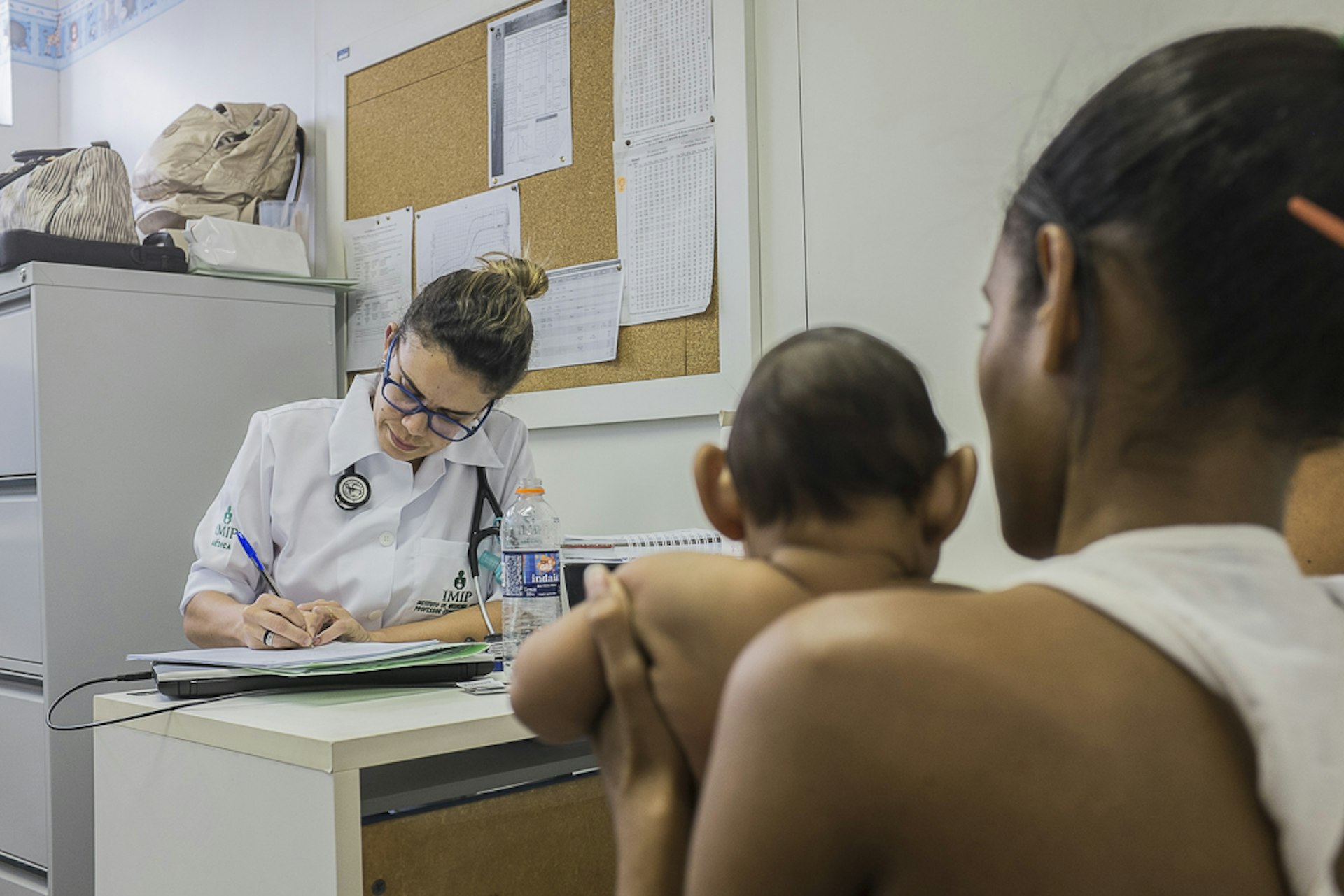 Pediatrician Danielle Cruz examines an infant with microcephaly at the IMIP (Instituto de Medicina Integral Prof. Fernando Figueira) in central Recife, Pernambuco