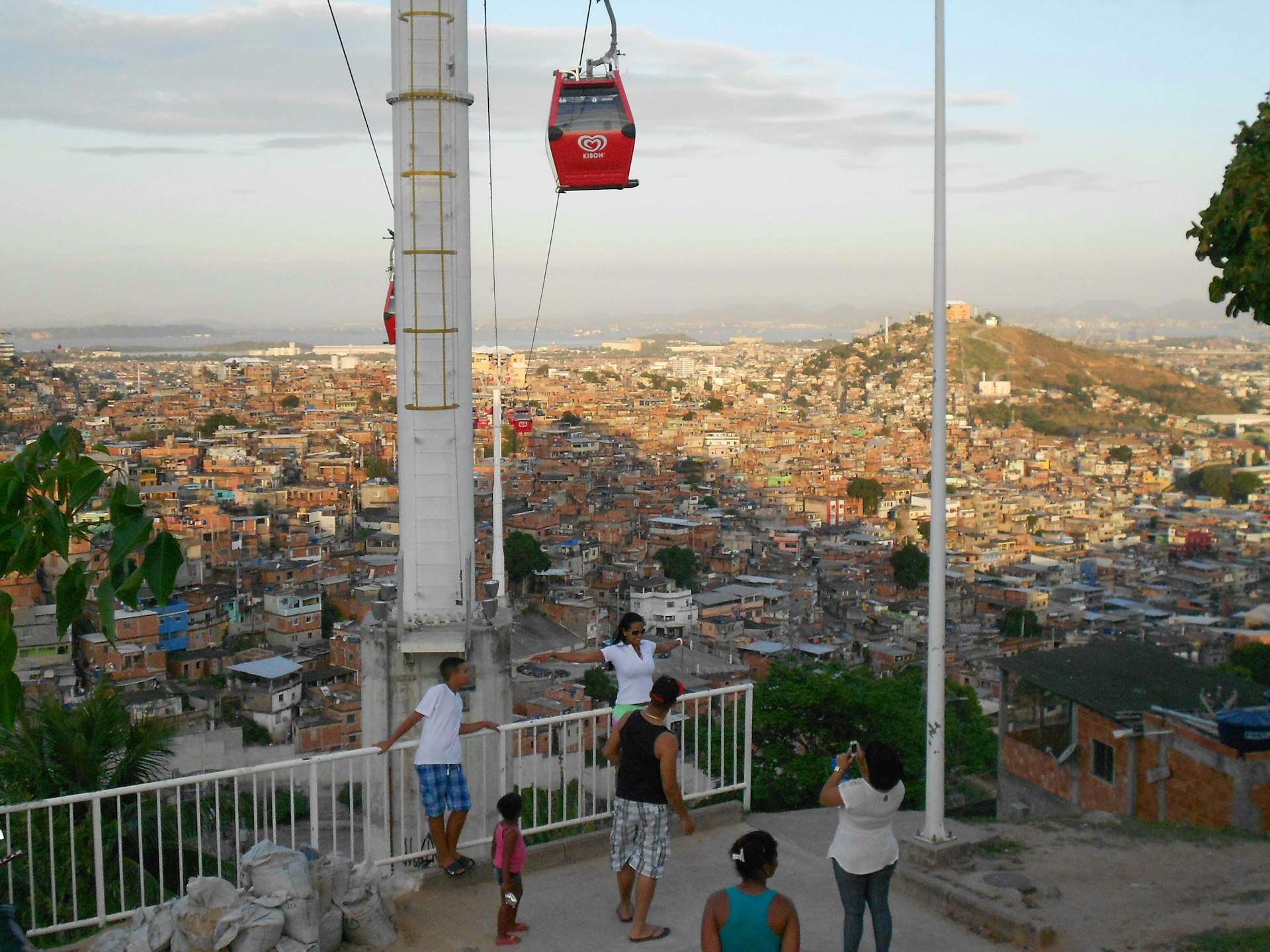Tourists Posing in front of the Cable Car of Complexo Alemao, Rio De Janeiro