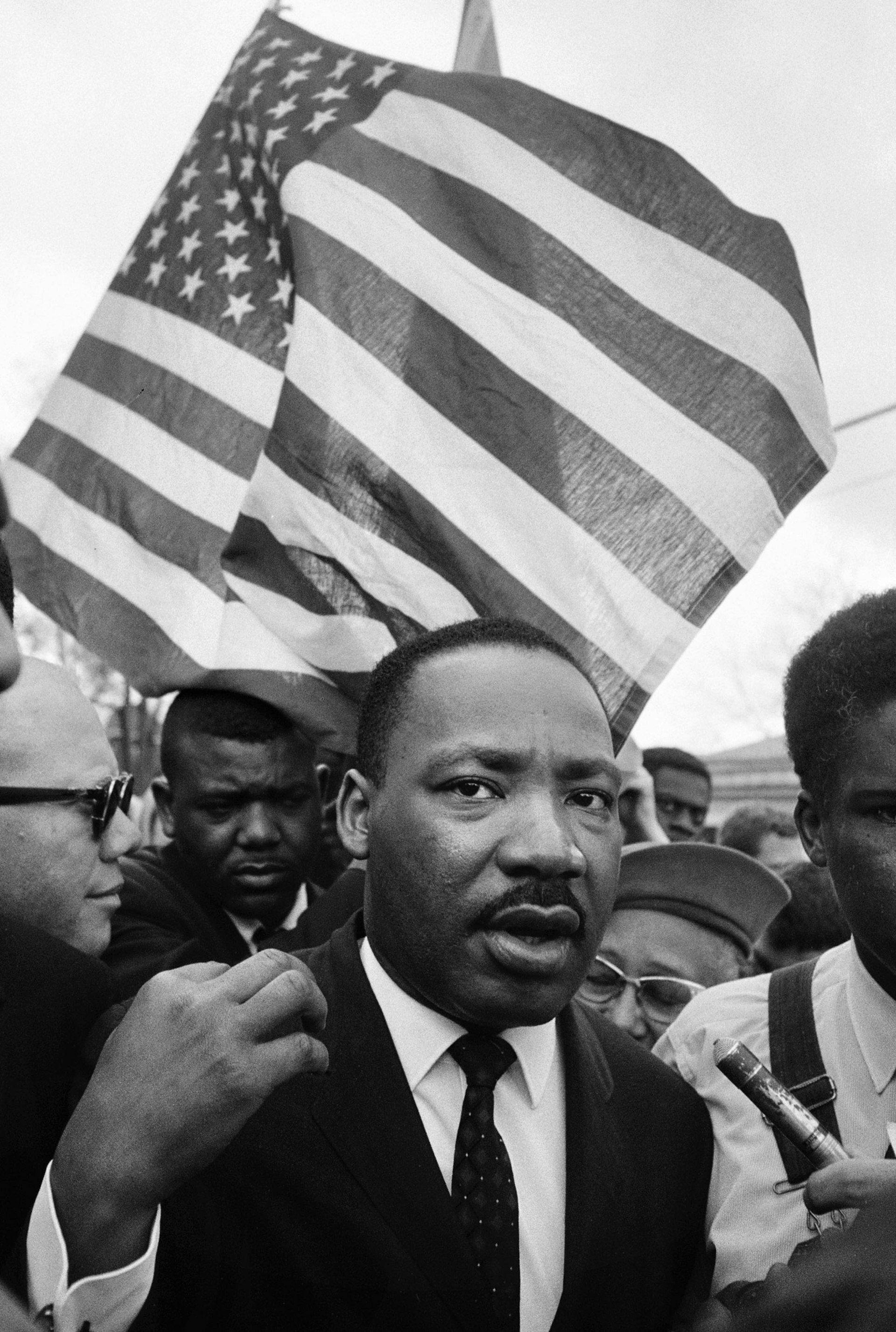 Martin Luther King with Flag, Selma March 1965 © Steve Schapiro