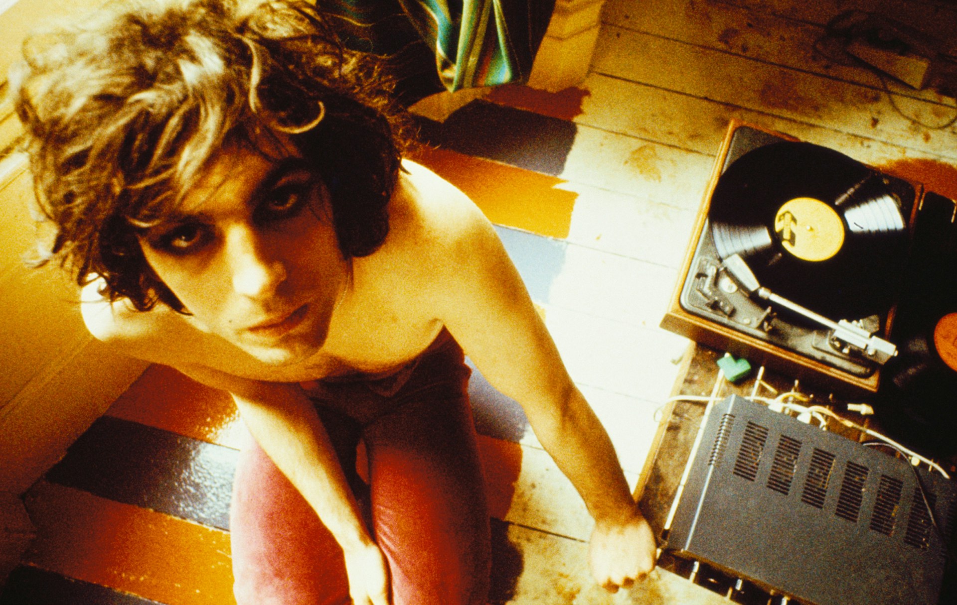 Syd Barrett with record player, London, 1969, © Mick Rock / courtesy The Print Room 