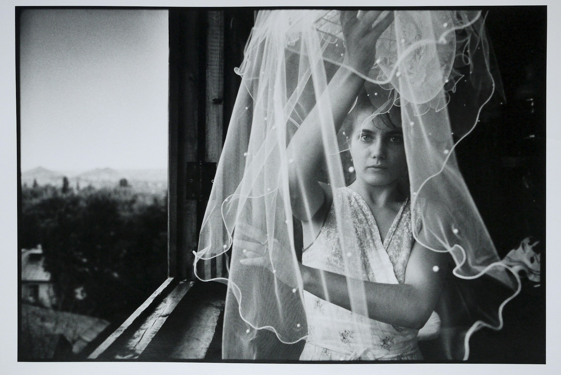 Irina Slakar preparing her veil on her wedding day. She is marrying Demitri, a former miner at the Socialist Donbass coal mine, Donetsk, June 1993.