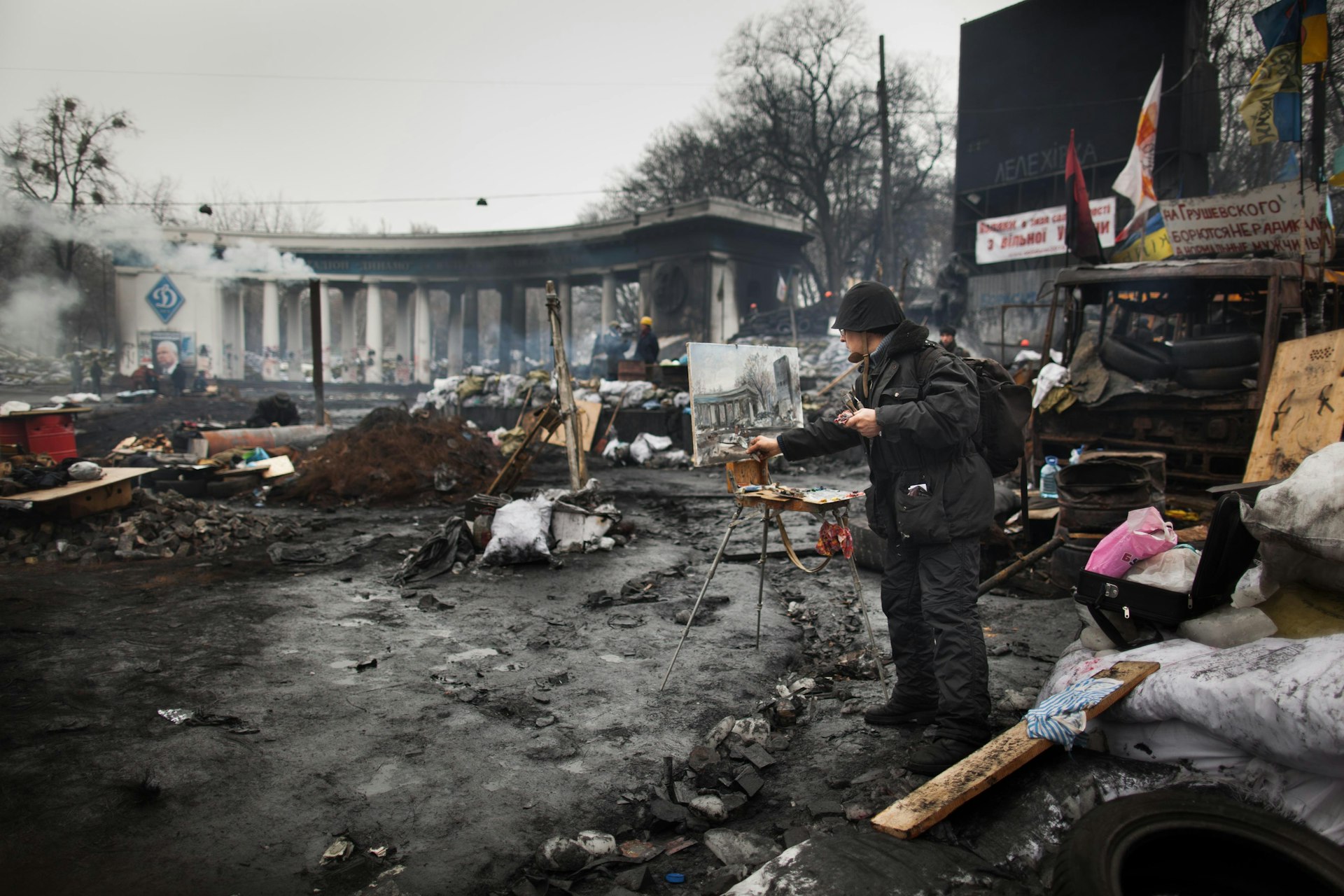 An artist paints during Ukraine’s Maidan protests, February 2014.