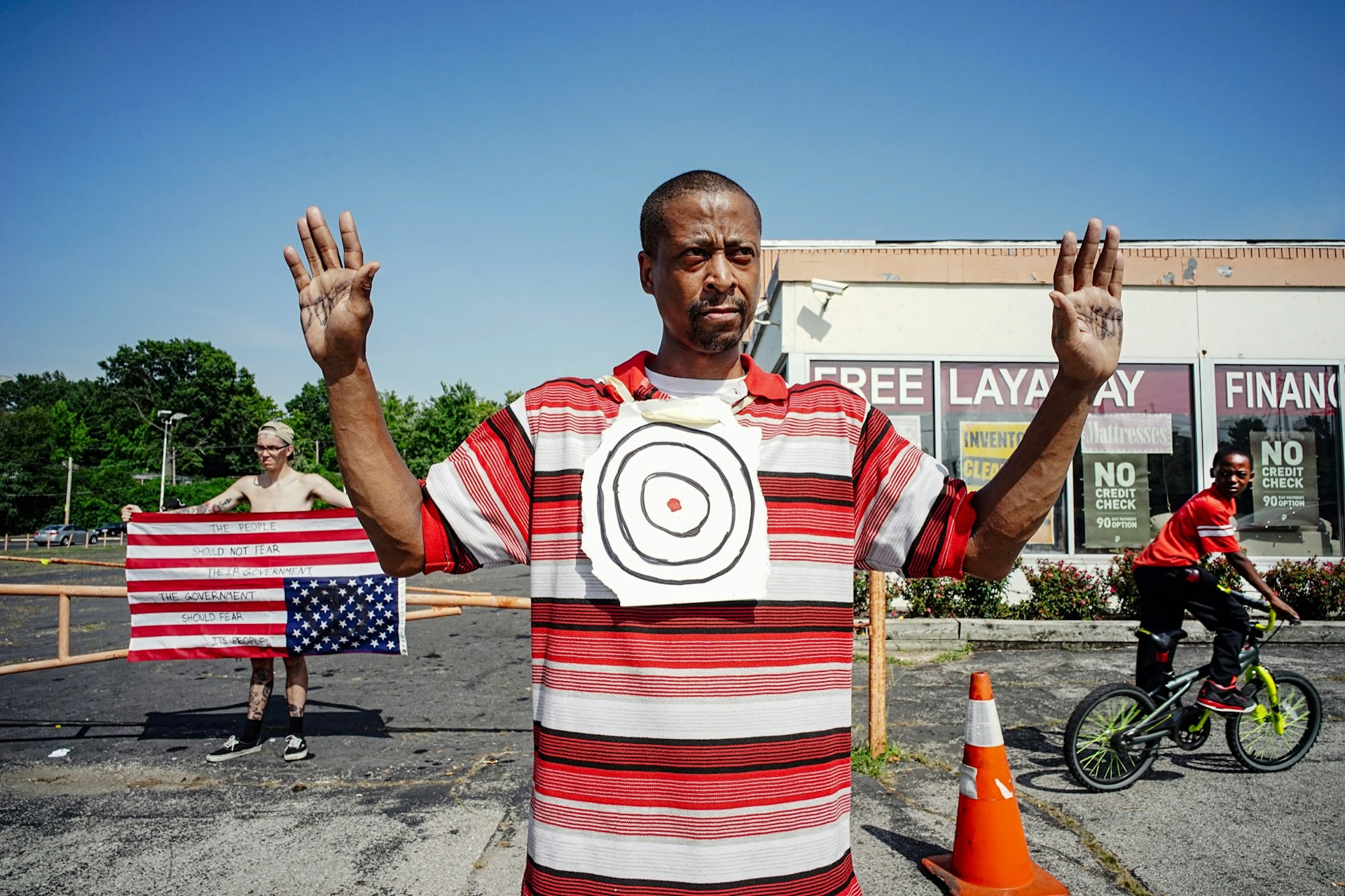 "Someone has to stand up to these crooked cops and now is the time," says Lawrence McNair while standing on Florissant Street in Ferguson, Missouri.