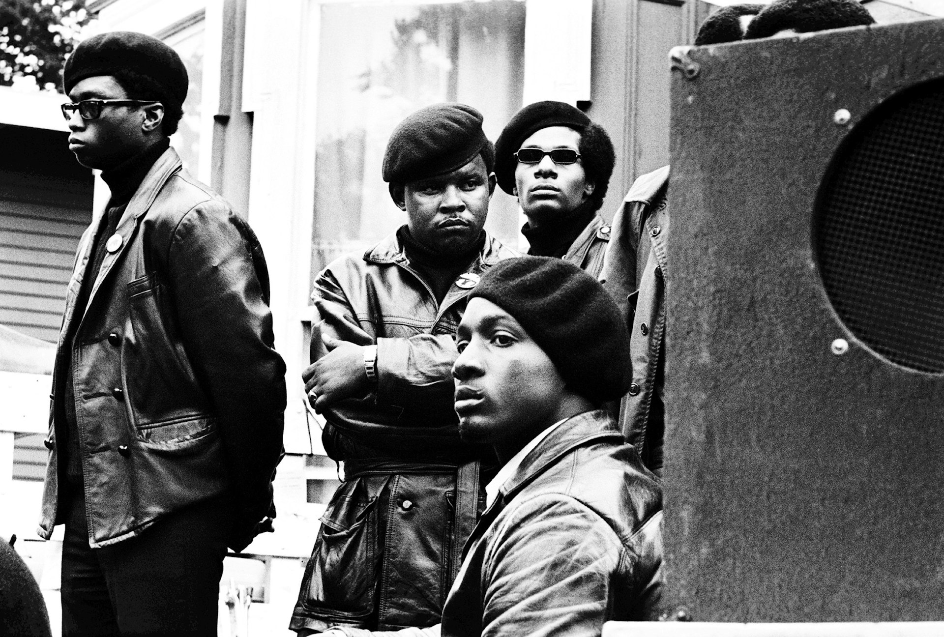 Panthers stand just offstage at a Free Huey rally in DeFremery Park, Oakland, 1968. Che Brooks (arms folded) was a San Francisco Panther who went to San Quentin State Prison and started the prison chapter.