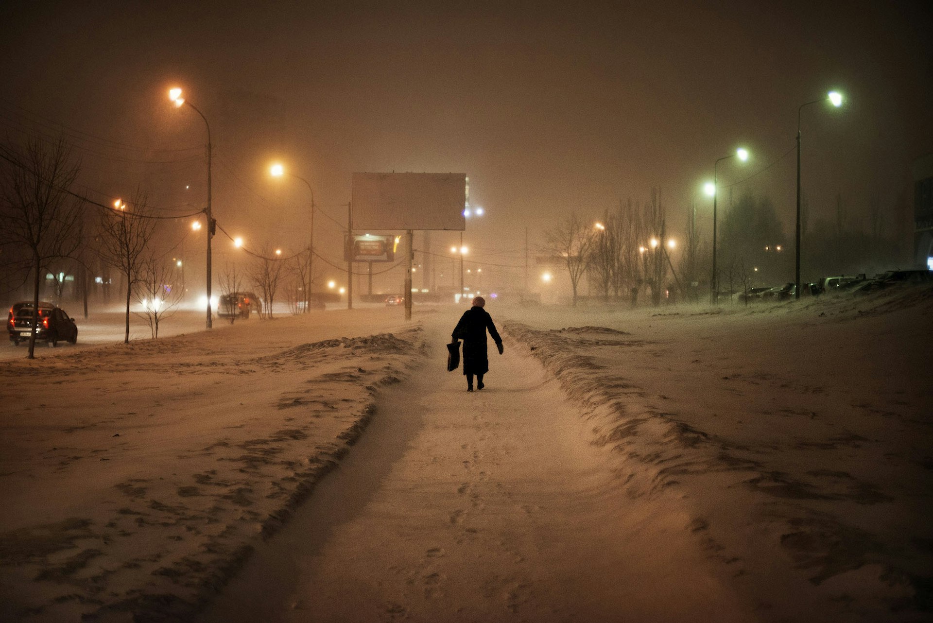 March 2013 - A woman walks on a street in the outskirts of Yekaterinburg.