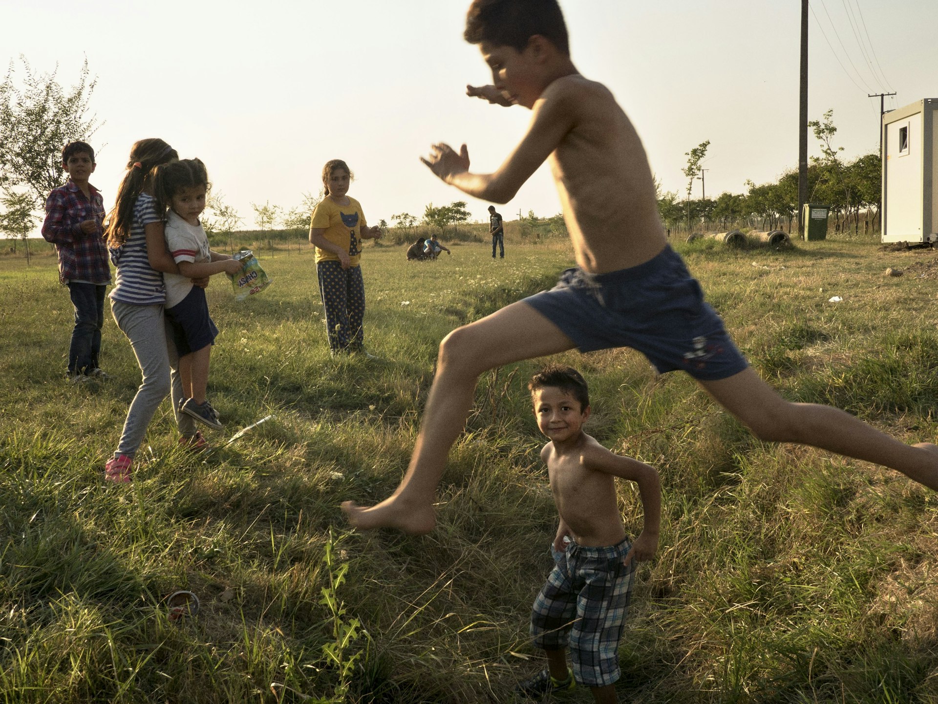 Syrian families, mostly from Aleppo, are placed in a refugee camp in Vasariste near the Serbian- Hungarian border. After a day to recover, they will walk and attempt to cross the Serbian-Hungarian  get to Serbia, the last country that stands between them and a European Union member state, Hungary. SERBIA. Vasariste. August 12, 2015 © Jerome Sessini