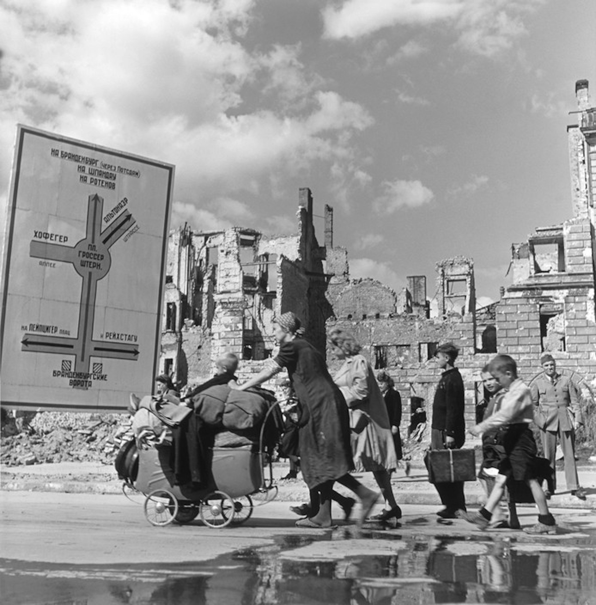 Robert Capa © International Center of Photography Berlin. 1945. Refugees making their way through the ruined Soviet sector.