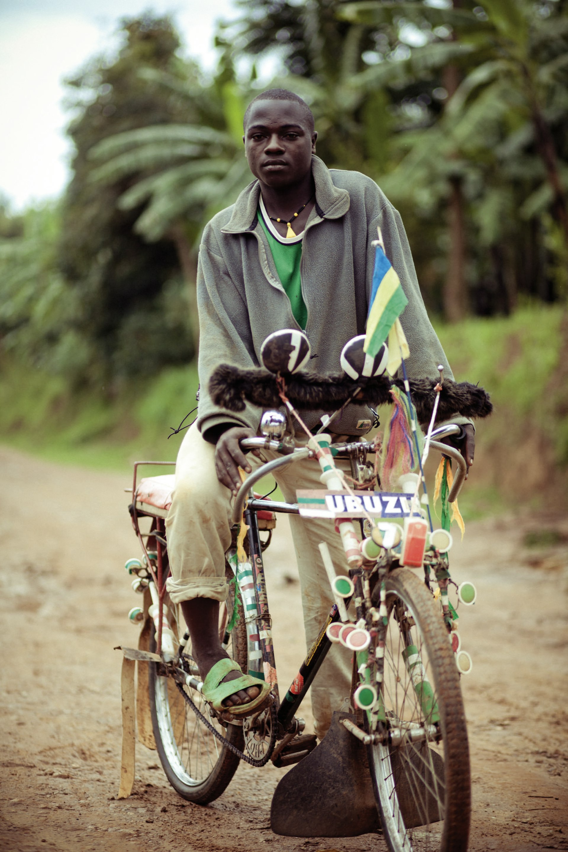Minawi John, aged 19, on his customised pedicab. Nyamesheke District, Rwanda