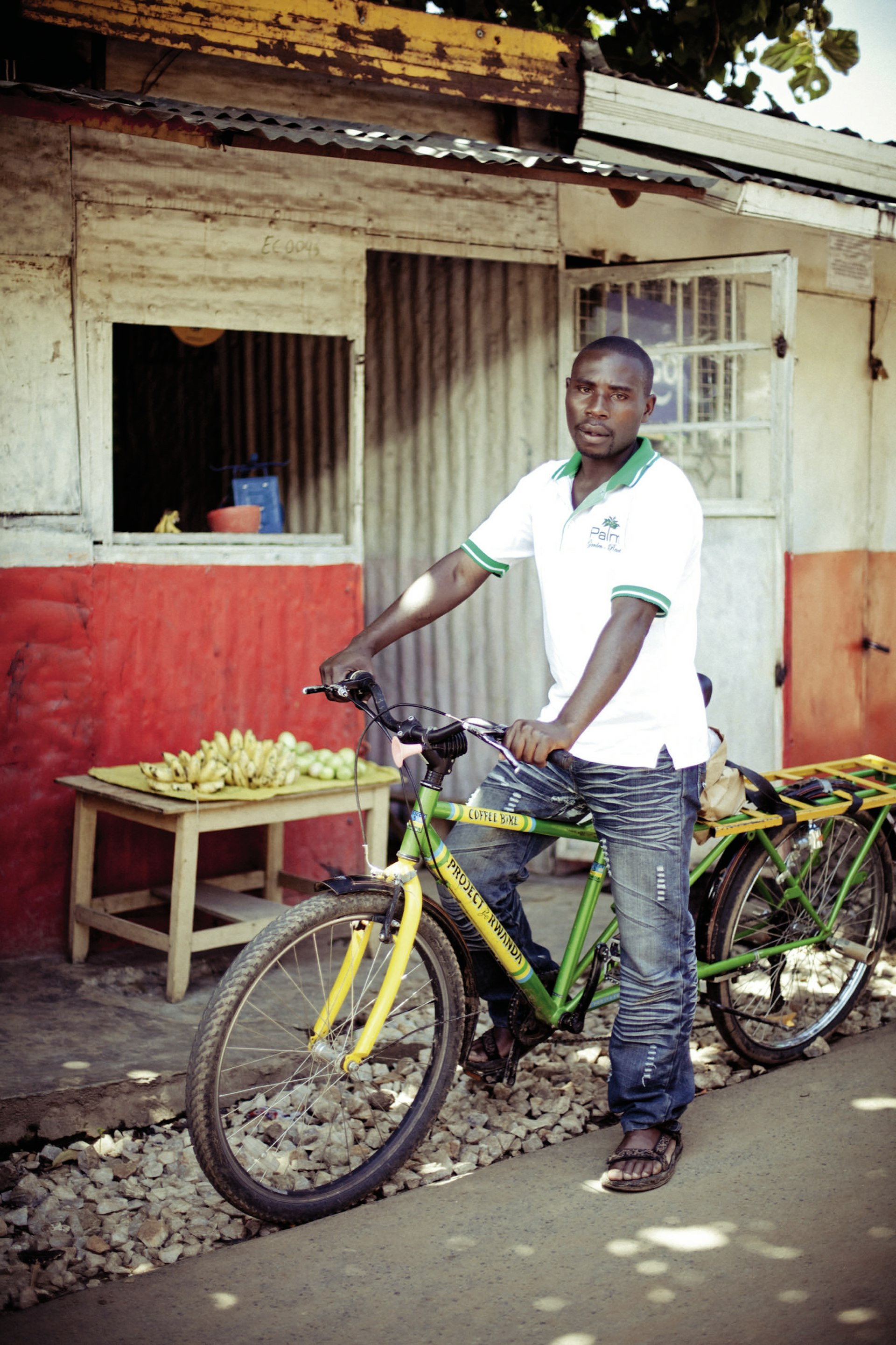 Turimumahoro John Bosco, aged 30, on a Project Rwanda Coffee bicycle
