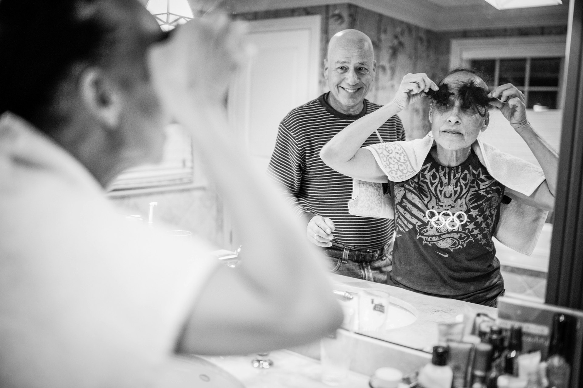 Nancy Borowick's mother and father, having cut their hair knowing it would fall out as a side-effect of chemotherapy. "Using humour allowed them to move forward and deal with what was happening because it was truly out of their control," says Borowick. Photo: Nancy Borowick.