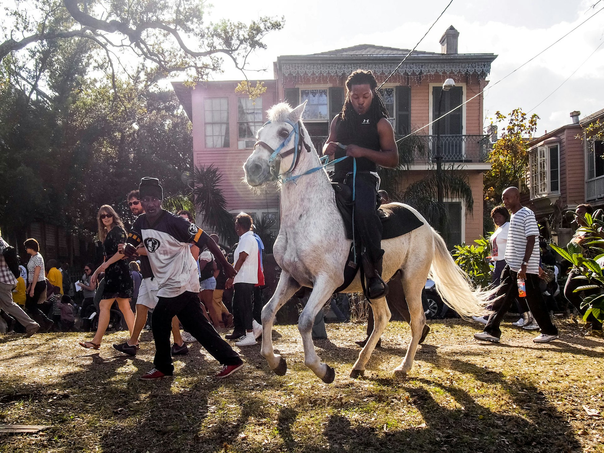 New Orleans, Louisiana. 2012. A Second Line parade: a local African American tradition where brass bands — known as the first line — march in the streets and are joined by members of the public — called the second liners. 