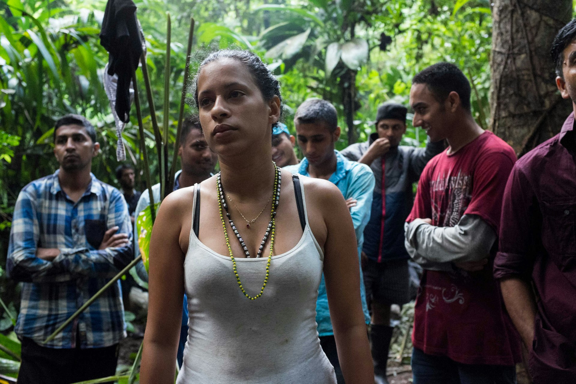 Liset at dawn in the Darien Gap, she and Marta are the only women among a group of almost 50 migrants and smugglers.
