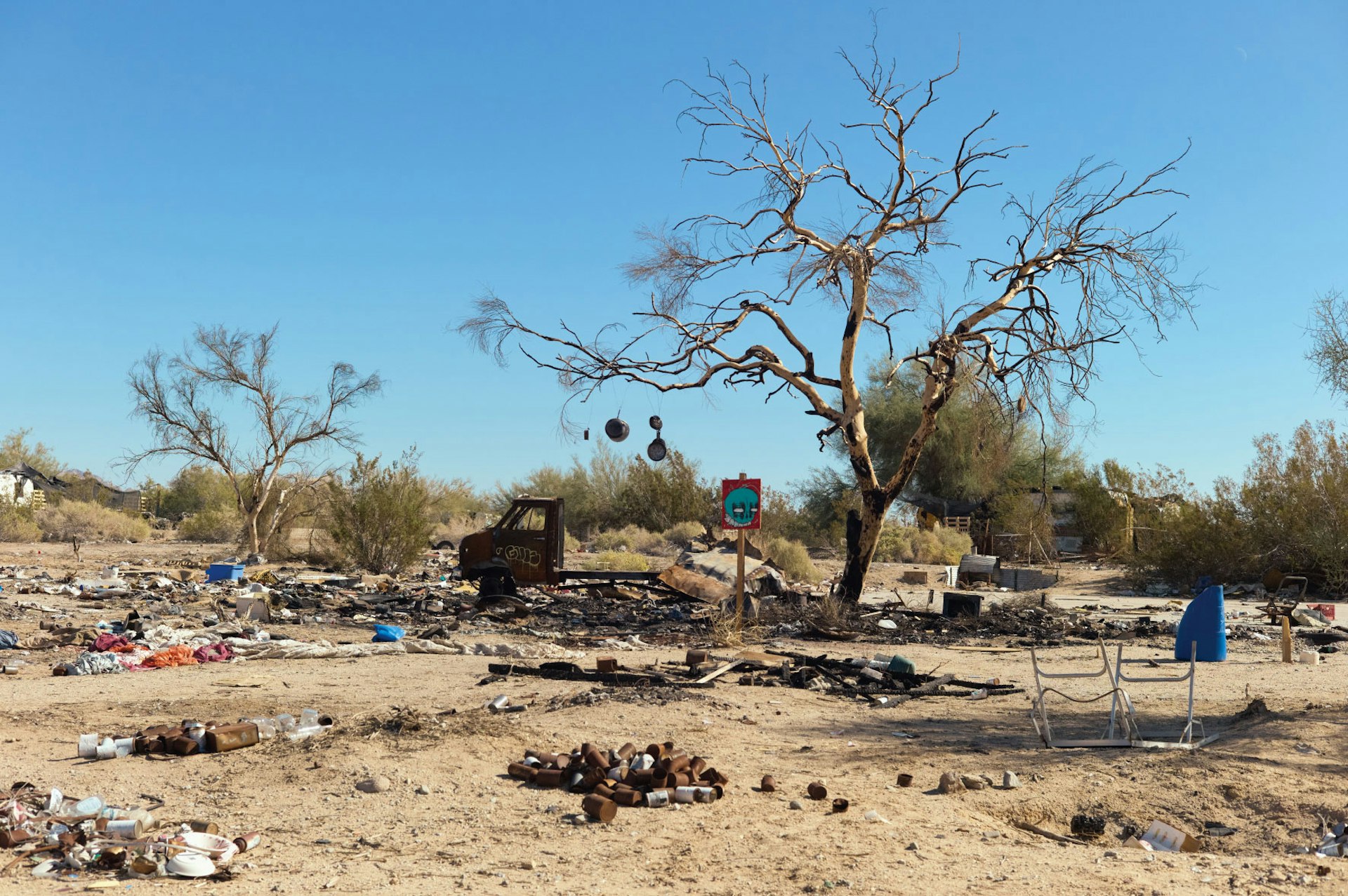 Burned down camp in Area 5, Slab City.