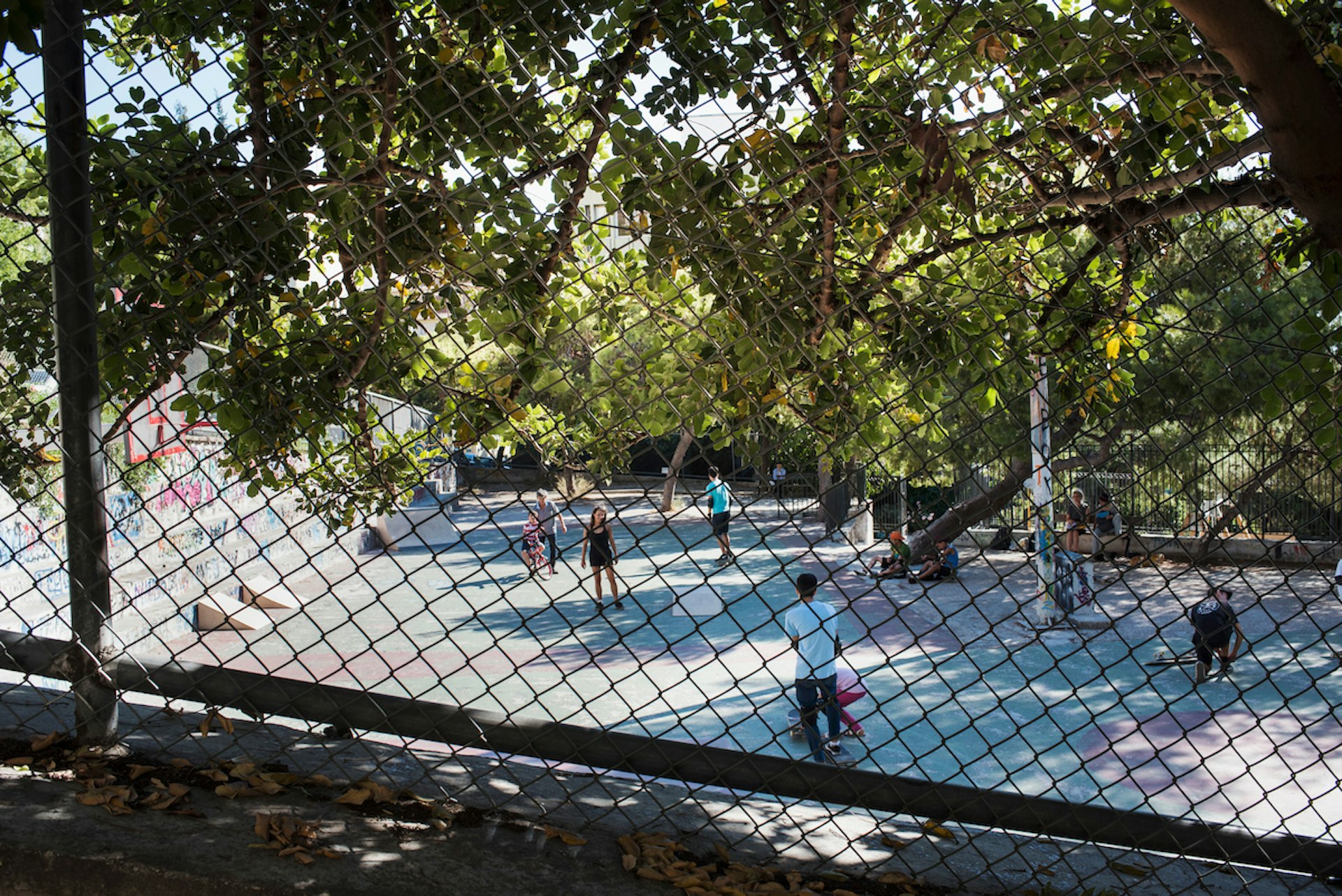 Refugee children taking skateboard classes at the Free Movement Skateboarding run by Will Ascott and Ruby Mateja in Exarhia, Athens.