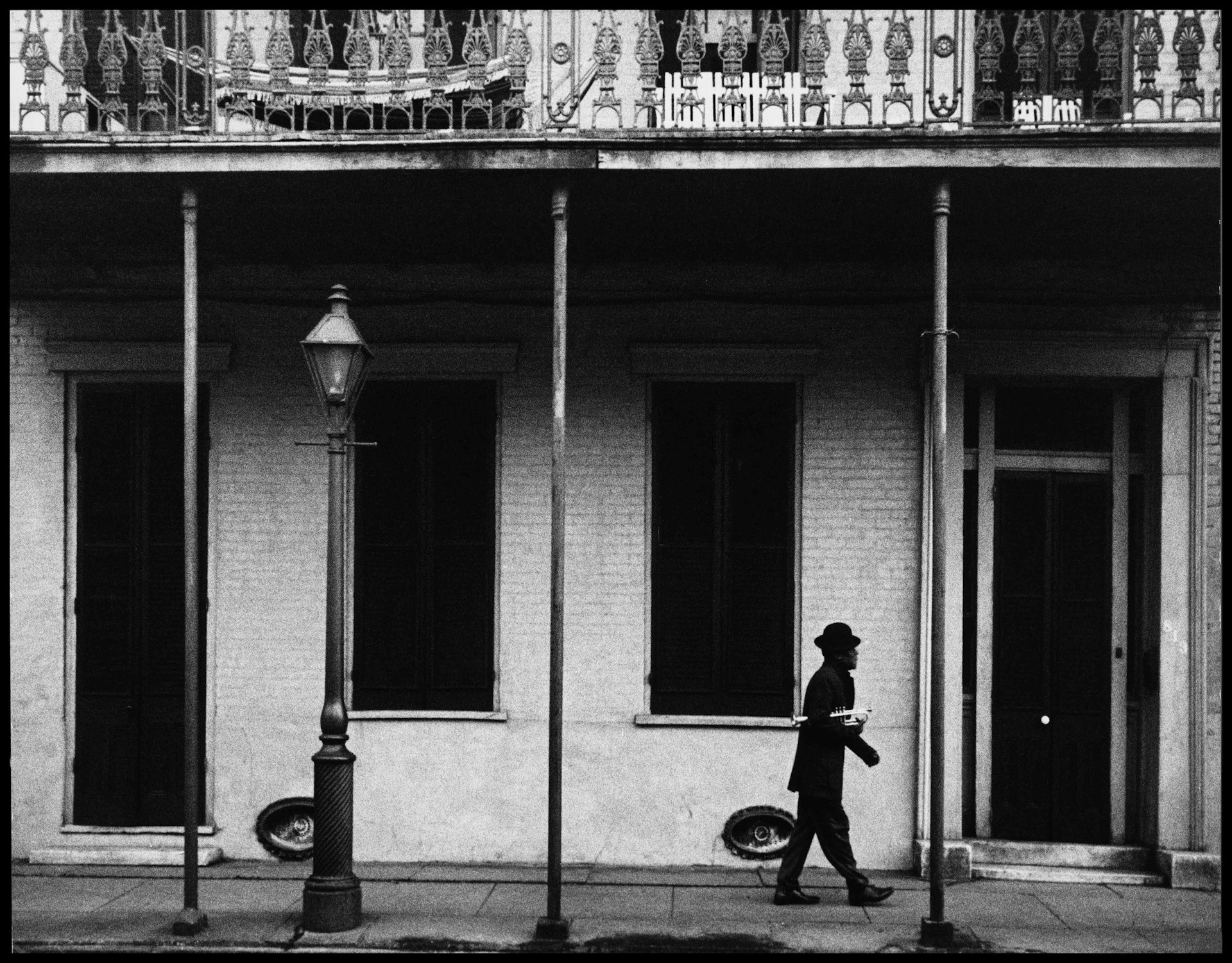 USA. New Orleans, Louisiana. 1958. Ernest MILLER nicknamed Kid Punch MILLER trumpet player and singer returning home at 6 am. © Dennis Stock / Magnum Photos