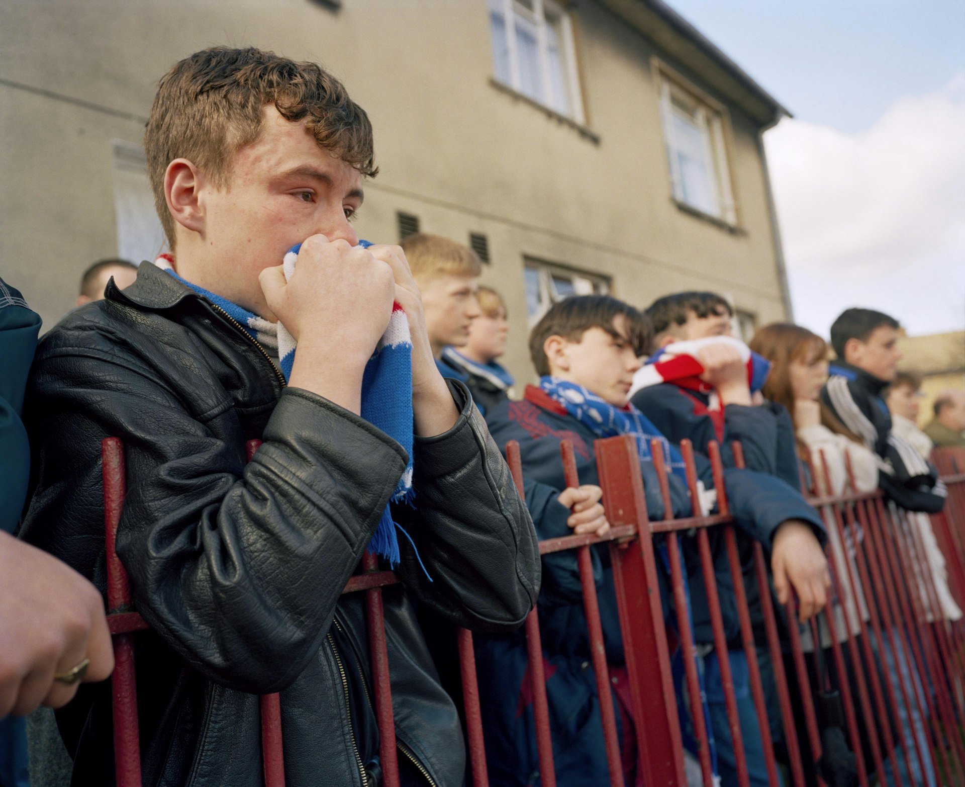 GB. Scotland. Glasgow. Rangers fans at the funeral of player Davie Cooper. He died of a brain haemorrhage, three years after retiring from the game. 1995. © Martin Parr/Magnum Photos