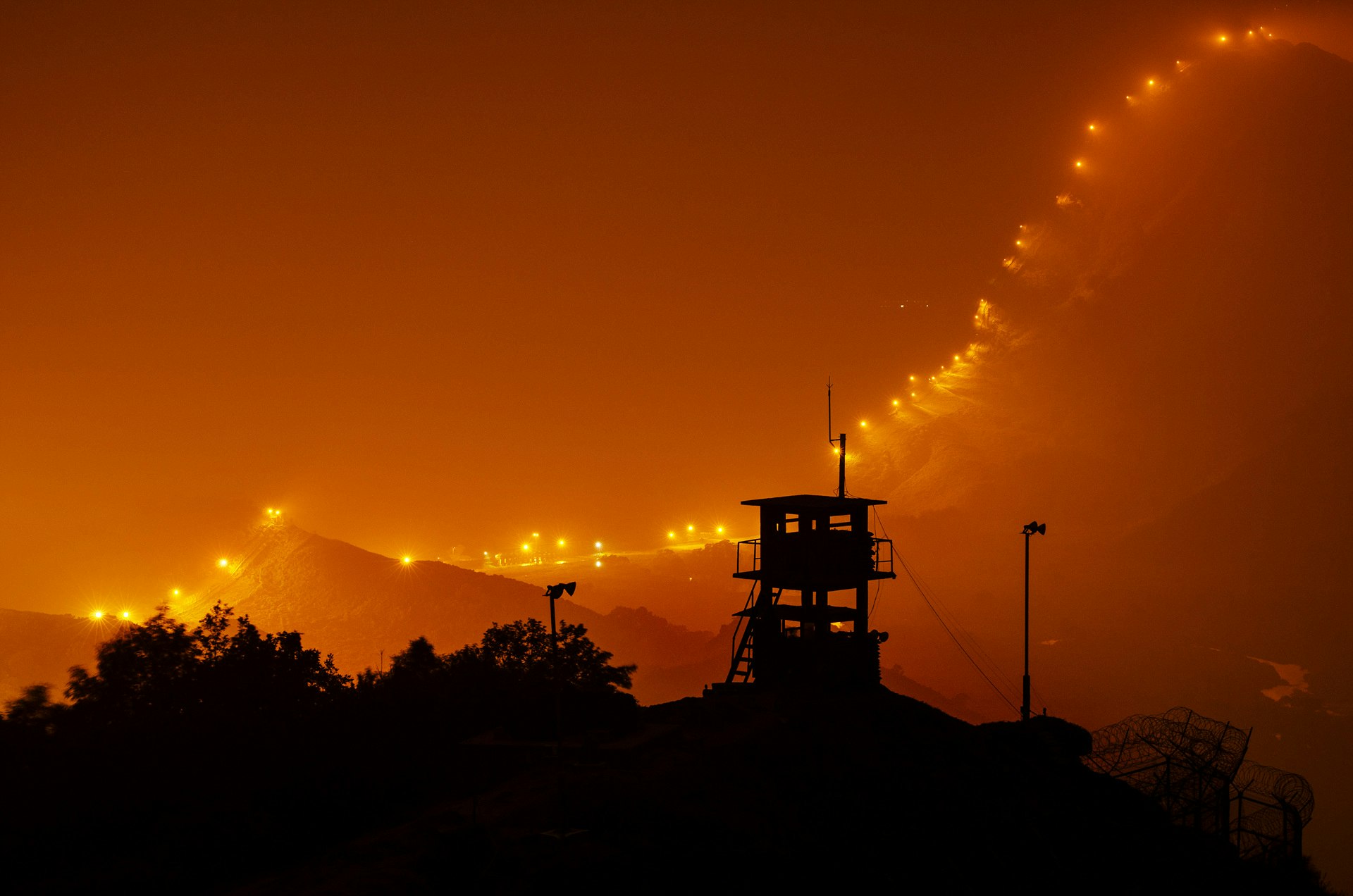 After sunset, countless lamps illuminating 248km of the DMZ fence to prevent enemy infiltration.