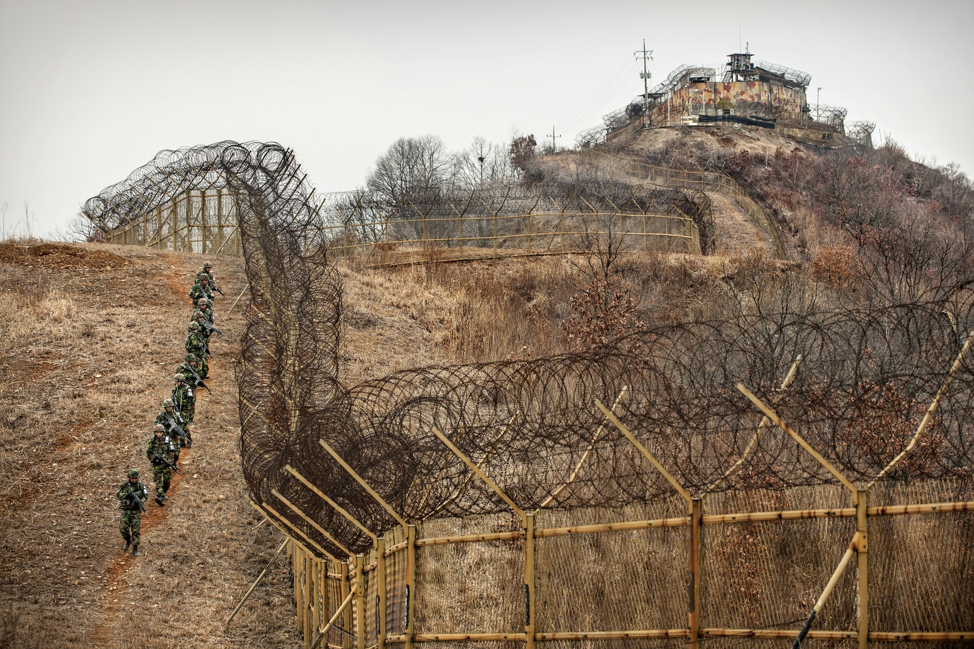 Squad along the barbed-wire fence of South Korean GP inside of the DMZ.