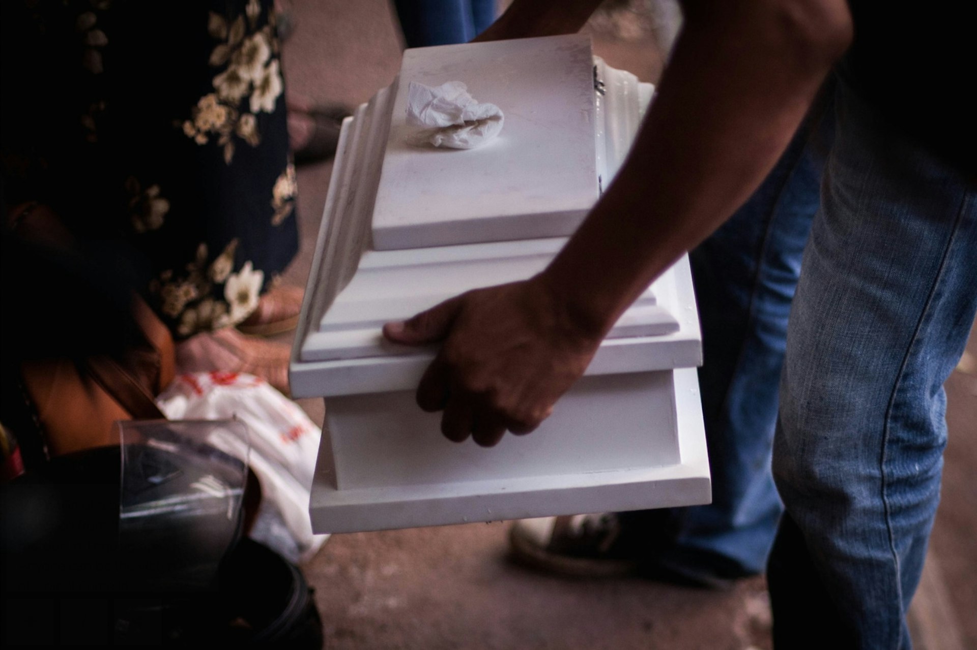 The coffin of a baby is removed from the forensic morgue in Tegucigalpa. 11th August 2017.