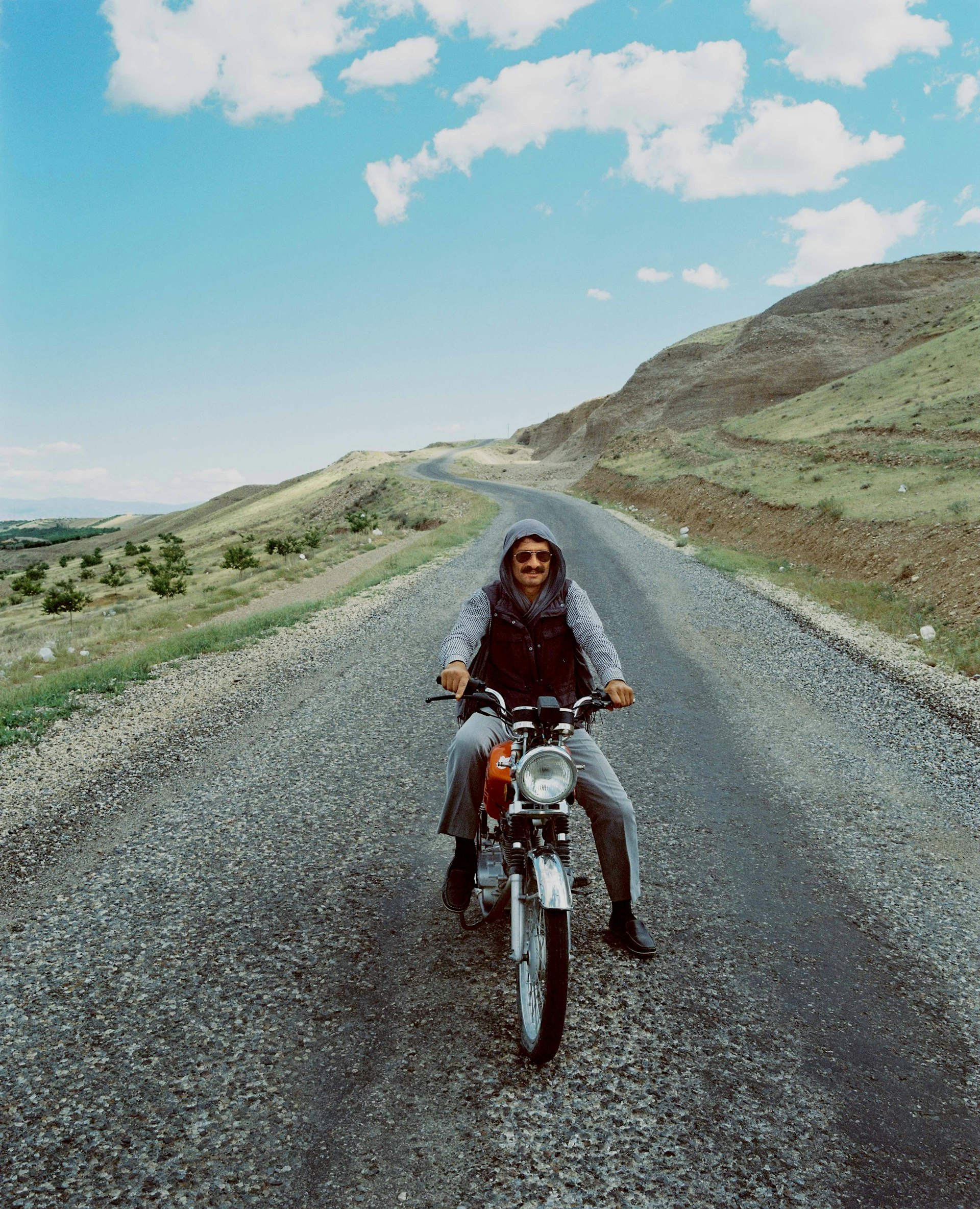 A man pauses on his motorbike near the Keban dam on the Euphrates River, Anatolia.