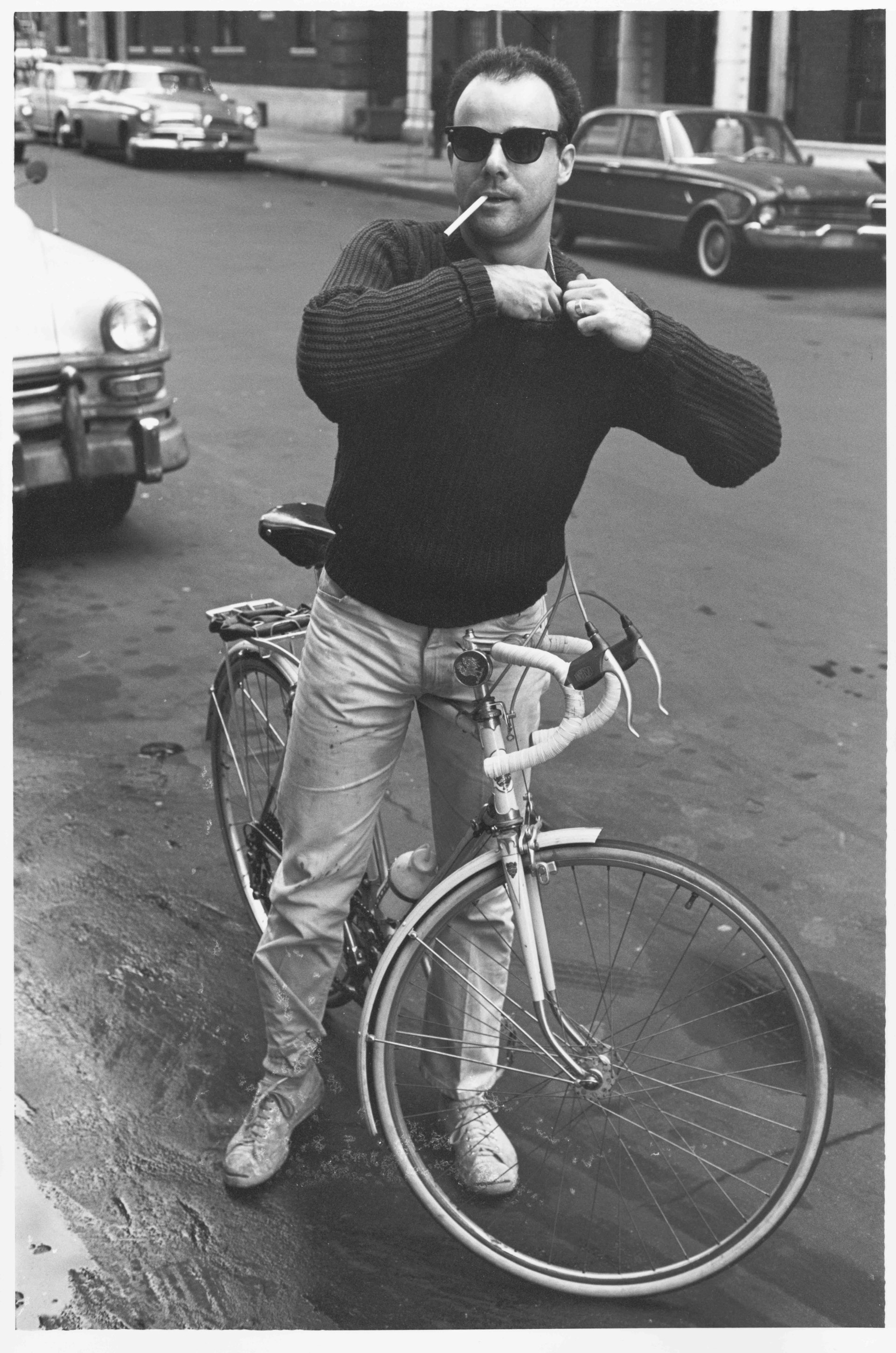 Mark Berghash on his bike, taking a break from his painting studio, 1964