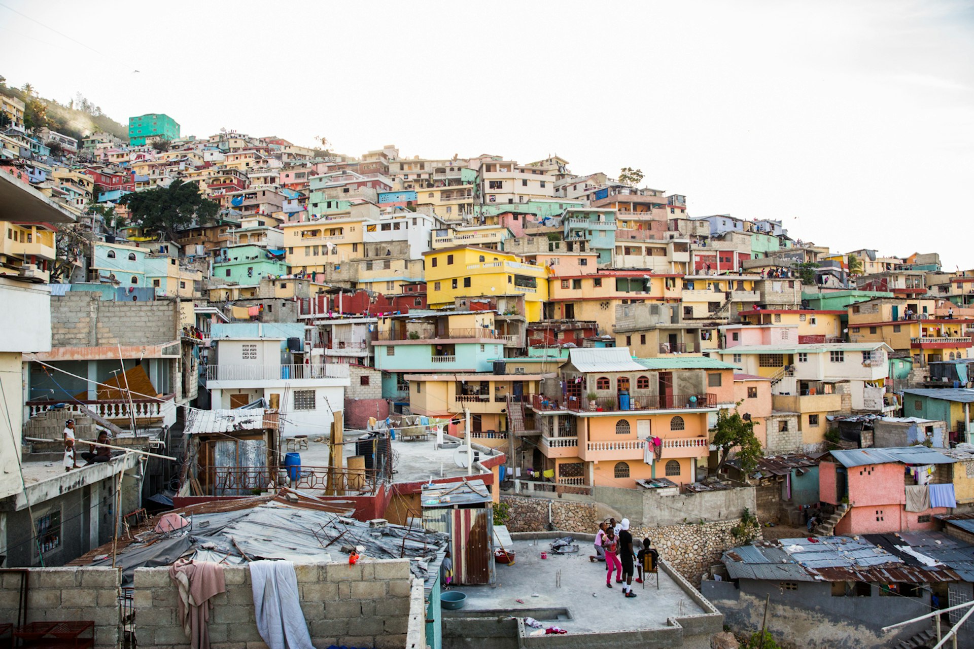 Jalouzi City, the largest slum in Port-au- Prince. In 2015, the houses were painted in color to uplift the community and bring hope. This mission was started by aresident and painter of Jalouzi, Duval Pierre.
