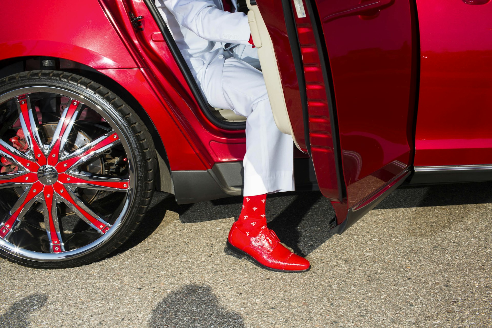 A student's shoes and socks match his ride on the way to the Northwestern High School Prom on Saturday, May 21, 2016 in Flint, Michigan.