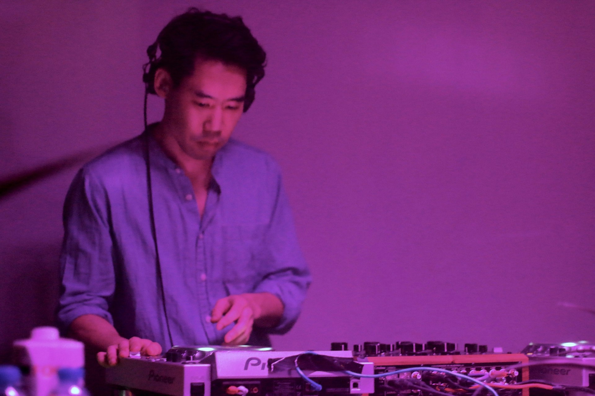 Hunee playing a DJ set at Synergia’s most recent fundraiser.