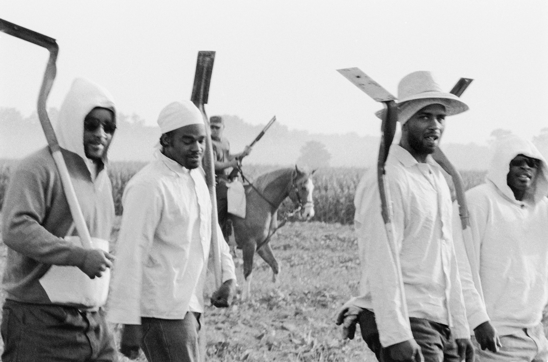 Chandra McCormick. MEN GOING TO WORK IN THE FIELDS OF ANGOLA, 2004.