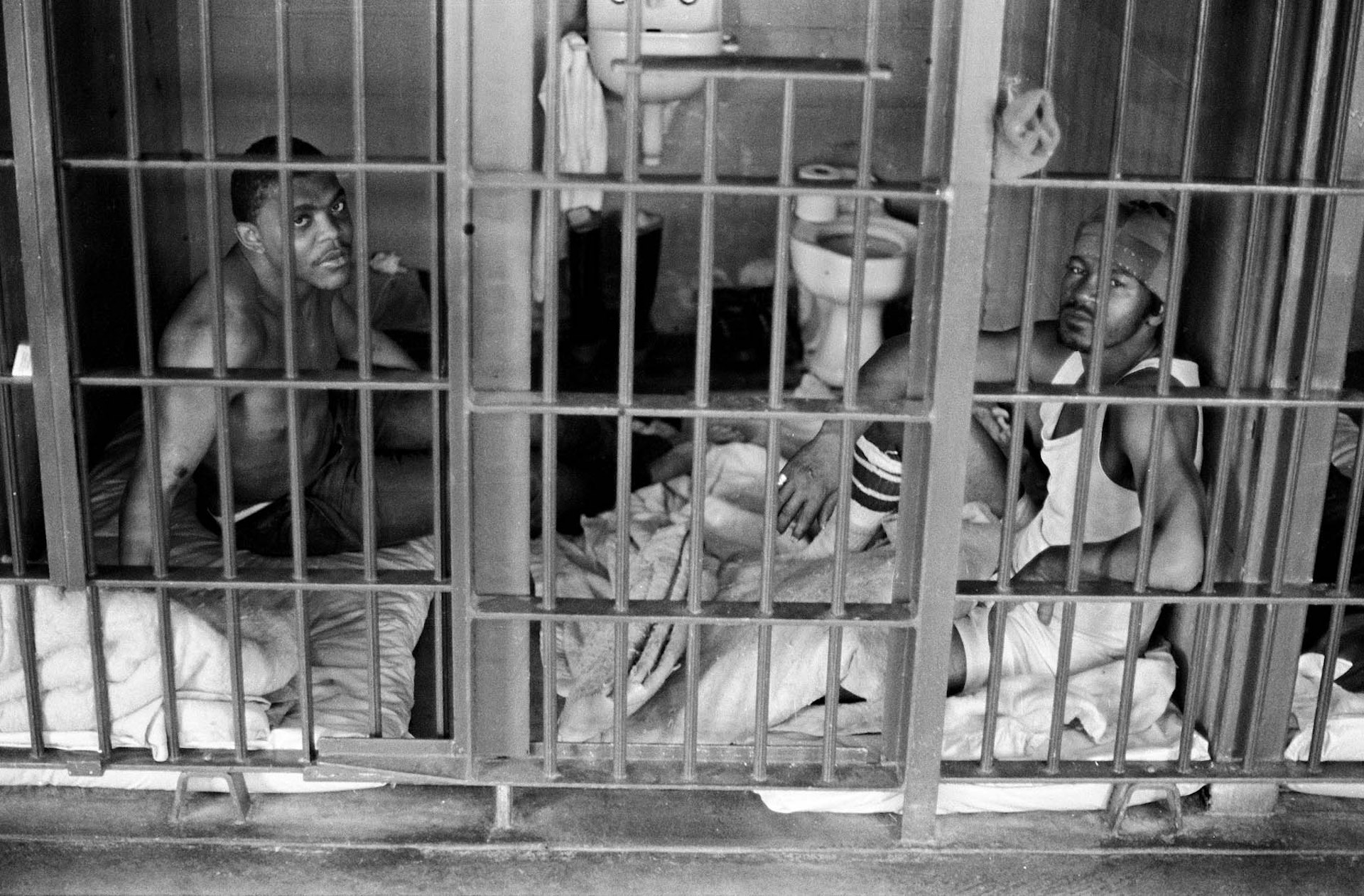Keith Calhoun. TWO TO A SIX-BY-EIGHT-FOOT CELL AT ANGOLA PRISON, 1980.