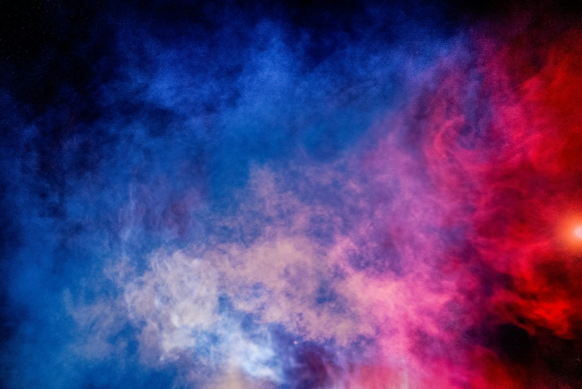 A composite of red smoke and blue smoke made from the lights and steam from the police cruisers in Flint.