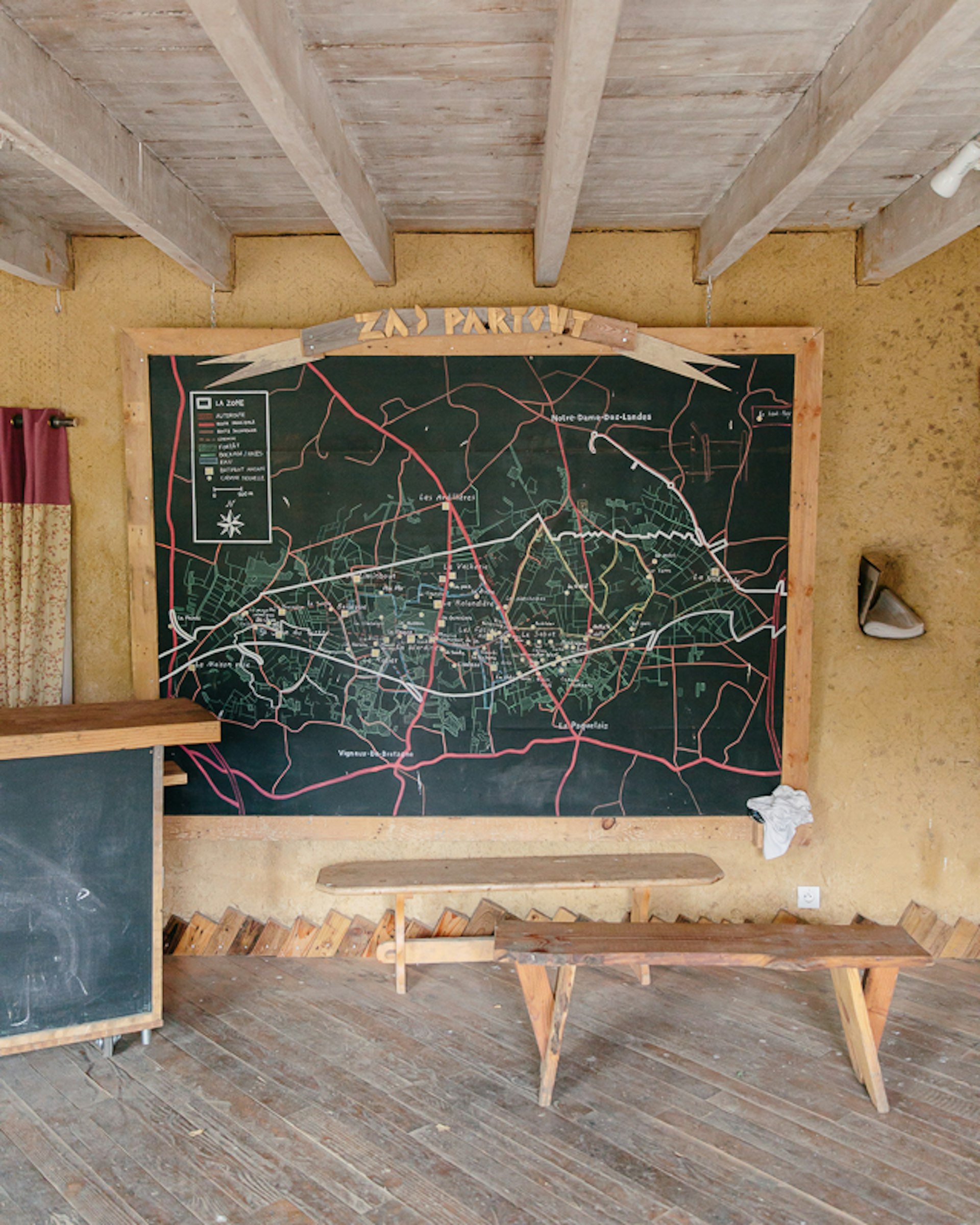 The ZAD reception at La Rolandière, where first-time visitors can receive more information about the ZAD. On the wall is a map which shows the occupied zone and the different collectives along the territory.