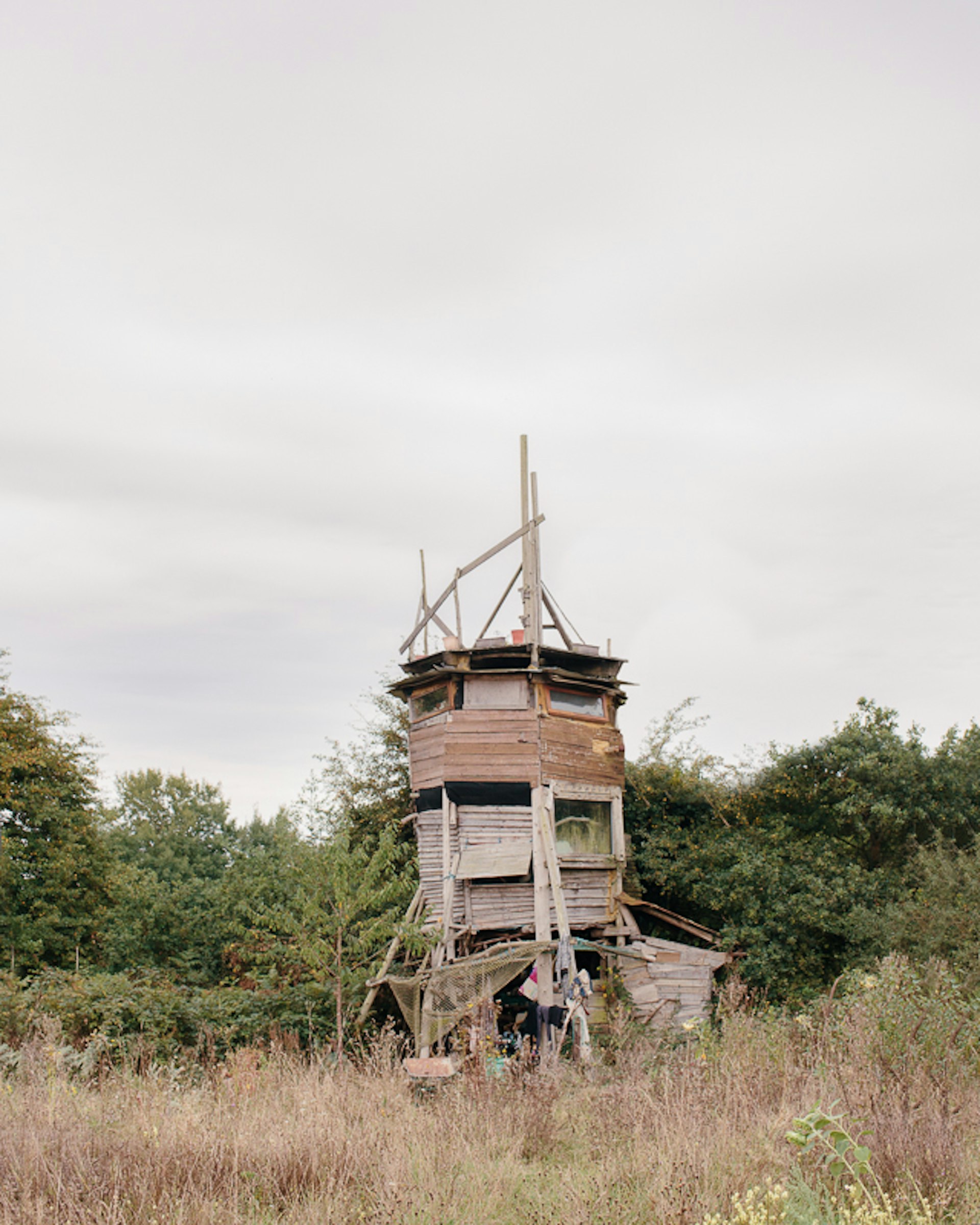 Le Tour, a tower which Alex has built from only found wood. He and his dog will live here until his mud house is finished.