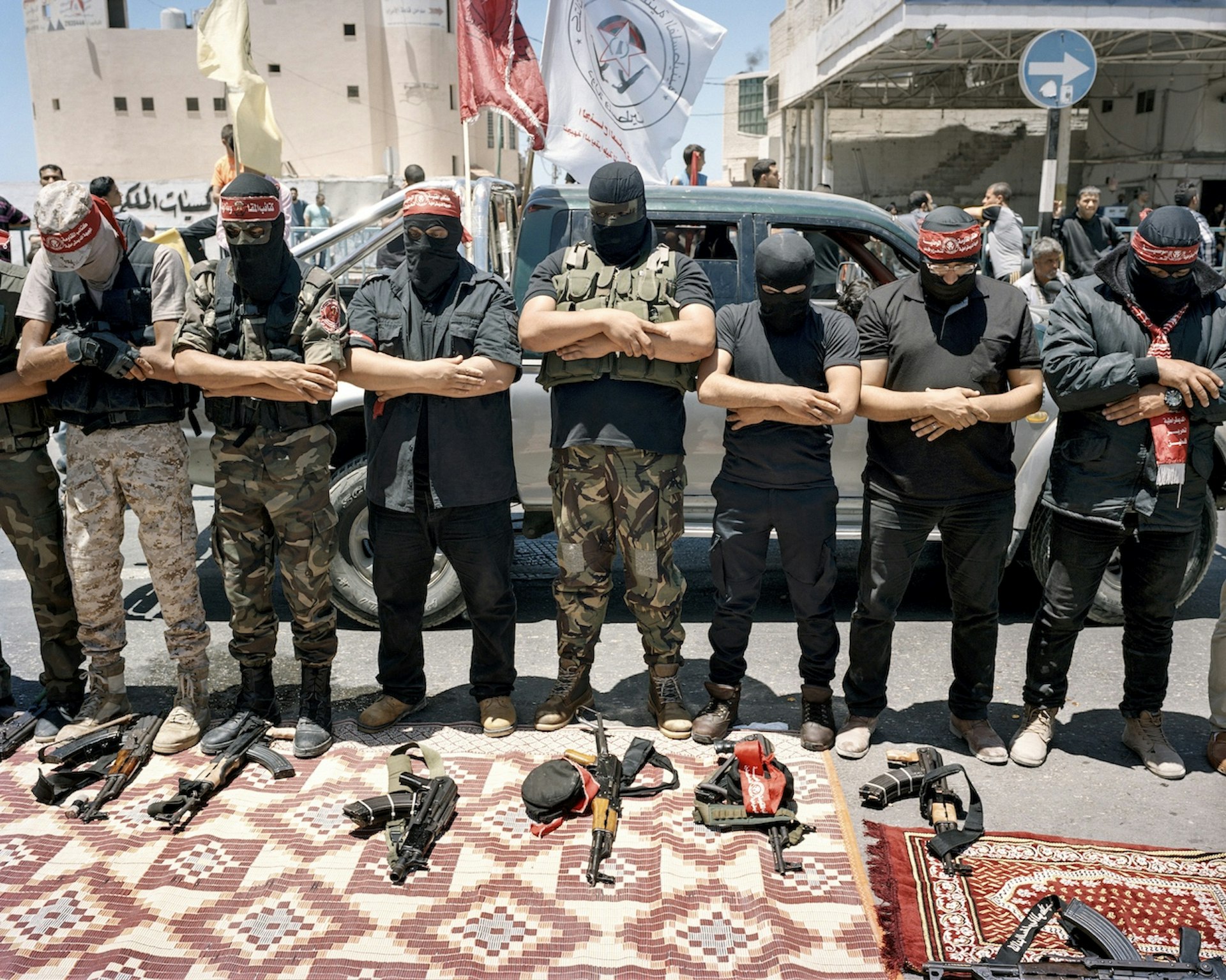 May 16, 2017. Gaza City, Gaza Strip. Palestinian fighters pray on the occasion of the funeral for the martyr Muhammad Majid Bakr. The young fisherman had been shot the previous day, on the Day of Nakba, by the Israel Defence Forces. The Day of Nakba (‘Catastrophe’) commemorates the expulsion of the Palestinians in 1948. According to information from the army, the fishing boat was outside of the fishing zone allowed by Israel. The fishermen did not react to shots fired into the air, shots were subsequently fired at the boat.