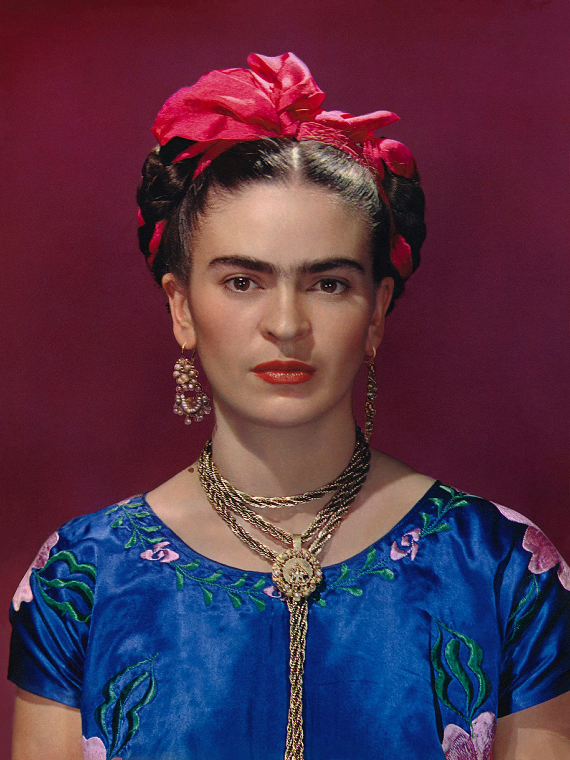 Frida Kahlo in blue satin blouse, 1939, photograph by Nickolas Muray © Nickolas Muray Photo Archives