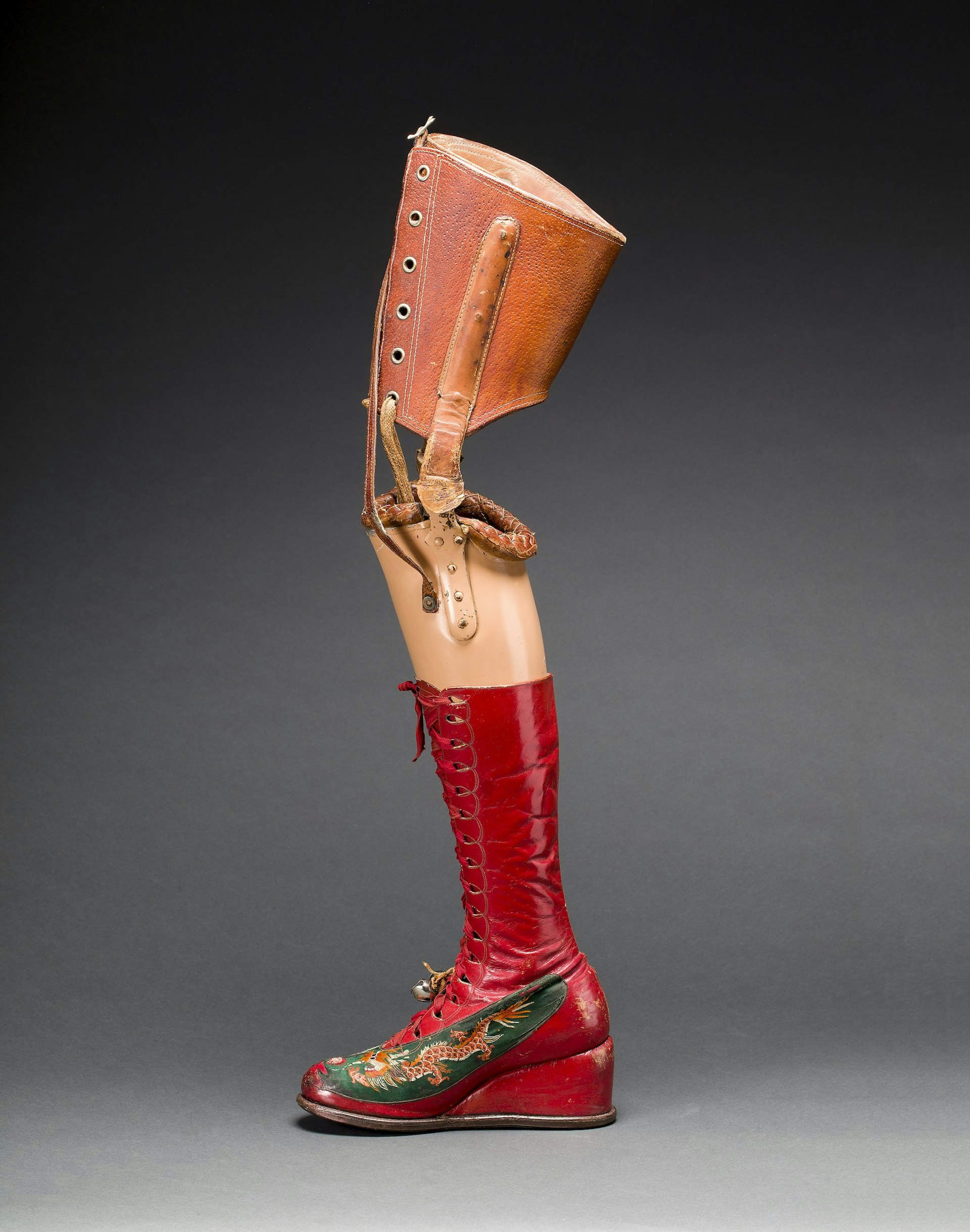 Prosthetic leg with leather boot. Appliquéd silk with embroidered Chinese motifs. Photograph Javier Hinojosa. Museo Frida Kahlo. © Diego Riviera and Frida Kahlo Archives, Banco de México, Fiduciary of the Trust of the Diego Riviera and Frida Kahlo Museums